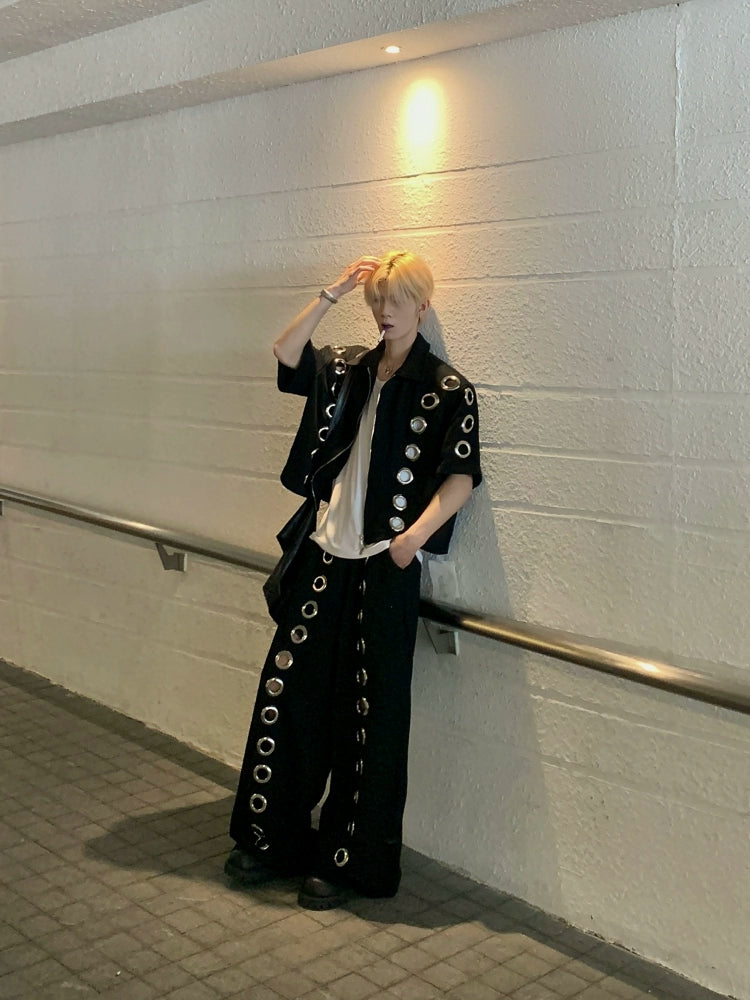 The Sanhoostudio two-piece set combines a cropped hoodie with metal ring hollow details and a matching bottom for a coordinated high street look. With its relaxed fit and edgy design, this set delivers both comfort and standout individuality for streetwear enthusiasts.