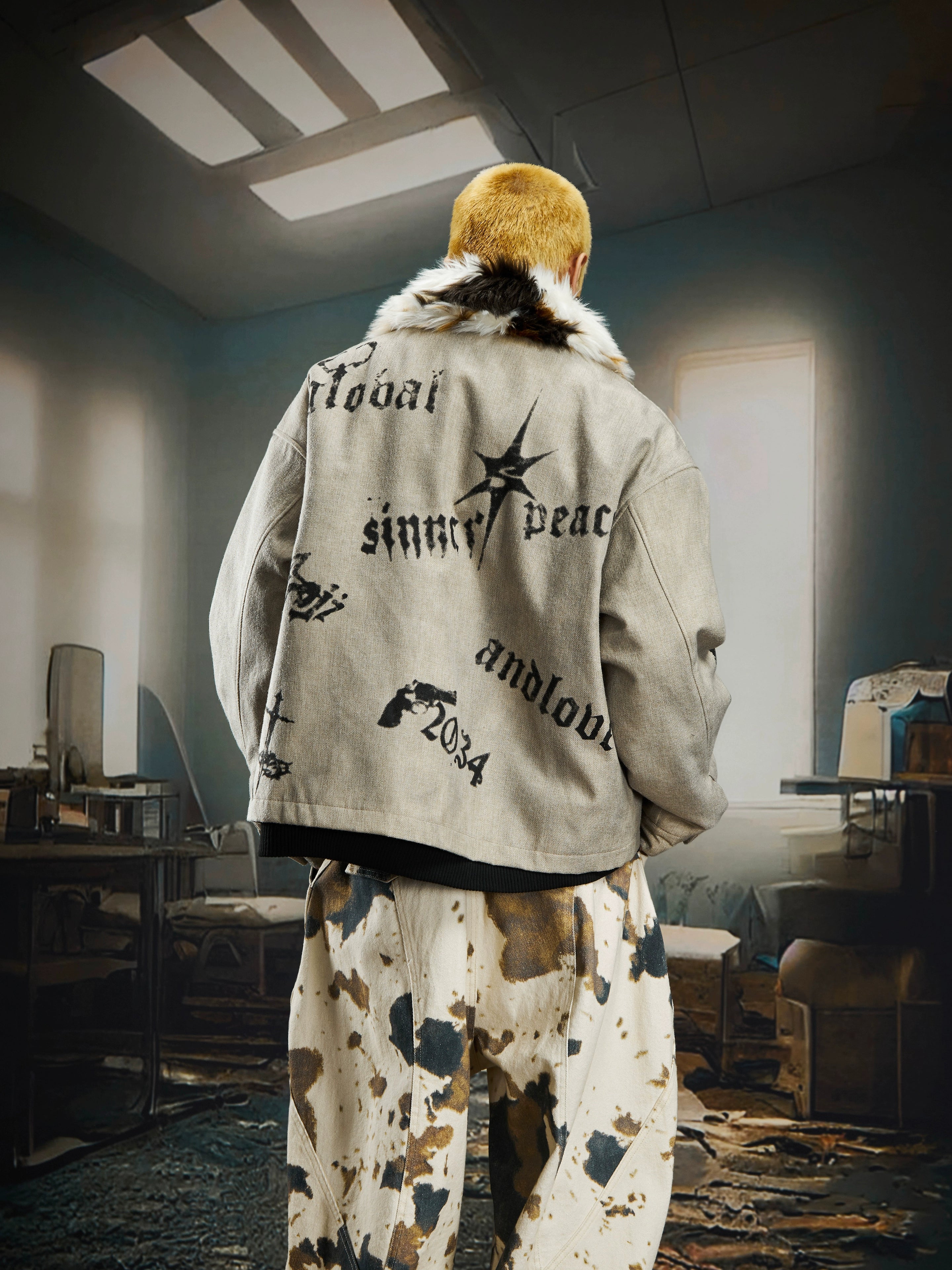 A dark punk-style padded jacket with gothic prints and a soft fur collar. Sanhoostudio’s signature street attitude meets warm winter protection.