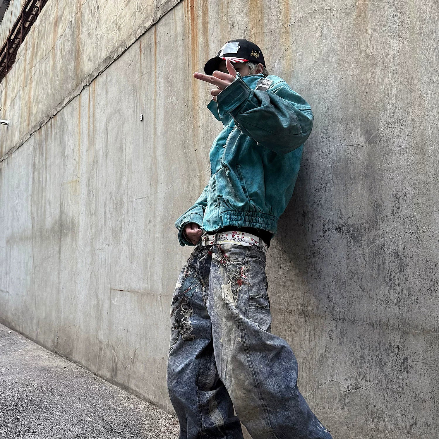 Sanhoostudio vintage-inspired canvas jacket crafted from 100% cotton. Featuring patchwork distressing, dyed finish, and a structured oversized fit that defines modern denim street style for all genders.