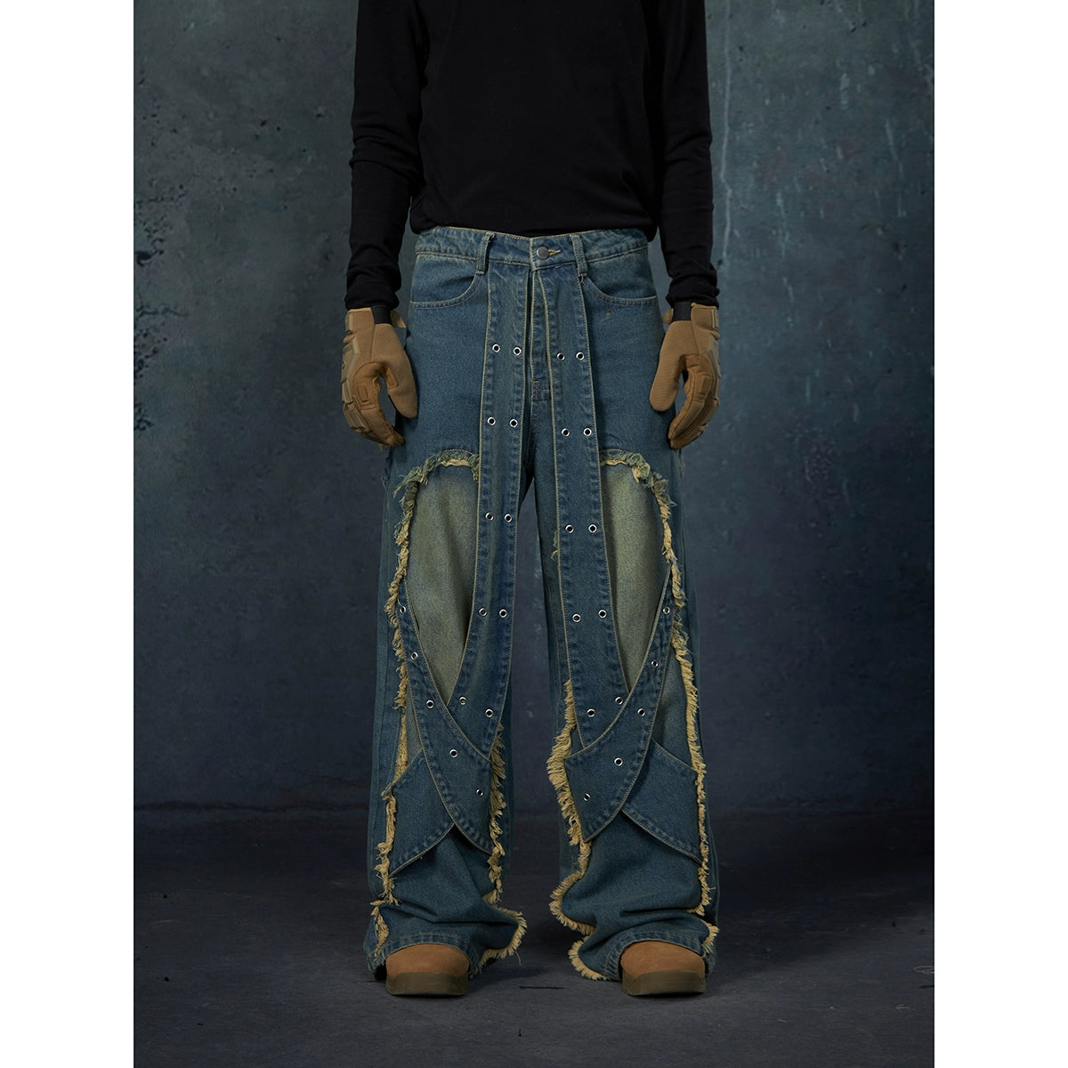 These Sanhoostudio jeans feature heavy deconstruction with strap patchwork, raw edges, and a vintage washed finish. Their oversized straight-leg silhouette adds a rugged, rebellious feel, blending avant-garde design with high street attitude.