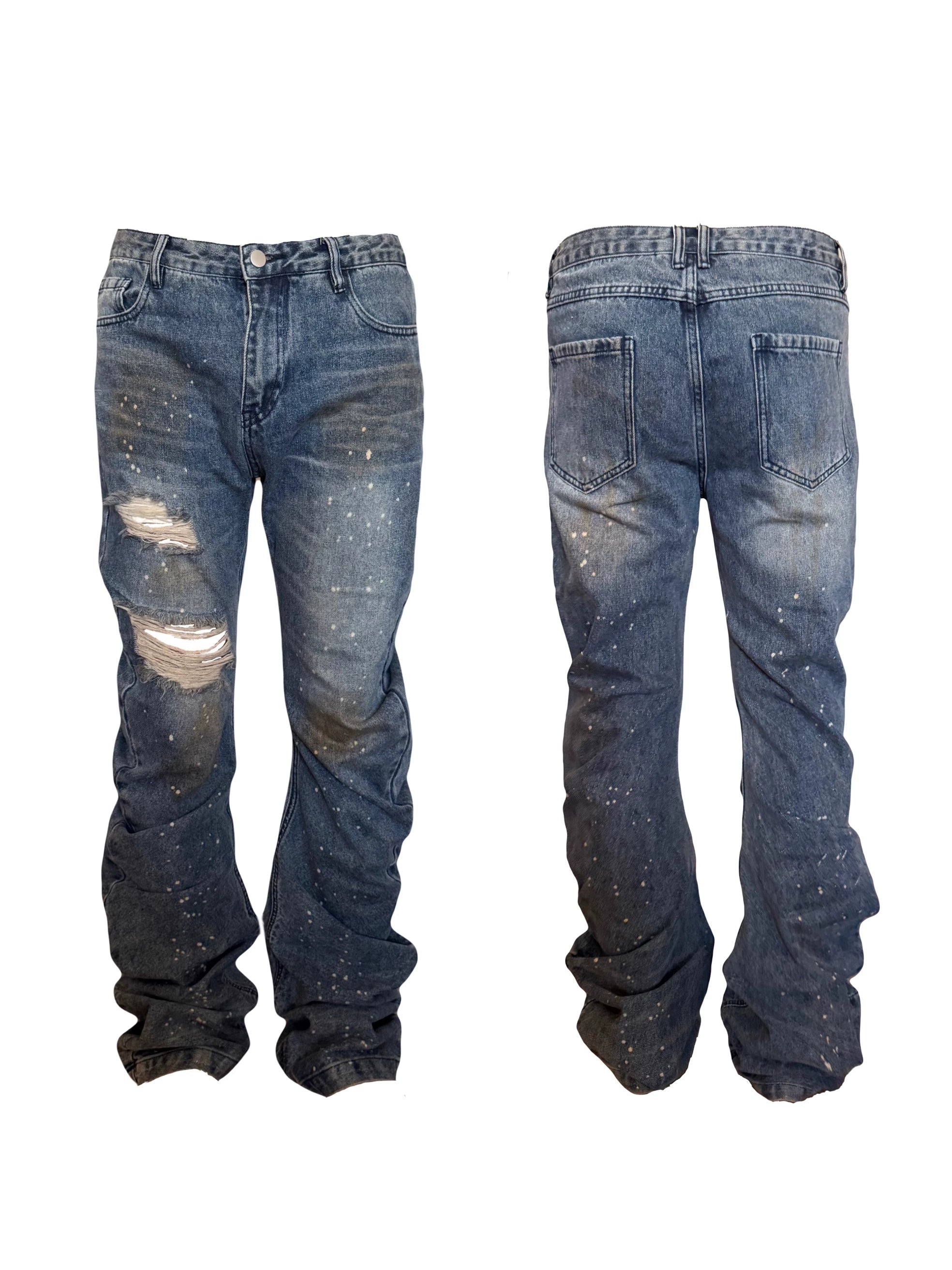 These blade-cut jeans by Sanhoostudio combine a heavy mud-dye wash, pleated textures, and distressed craftsmanship to create a futuristic yet rugged aesthetic. Perfect for grunge-inspired styling, high street fashion, or unique streetwear looks, they deliver both edge and originality.