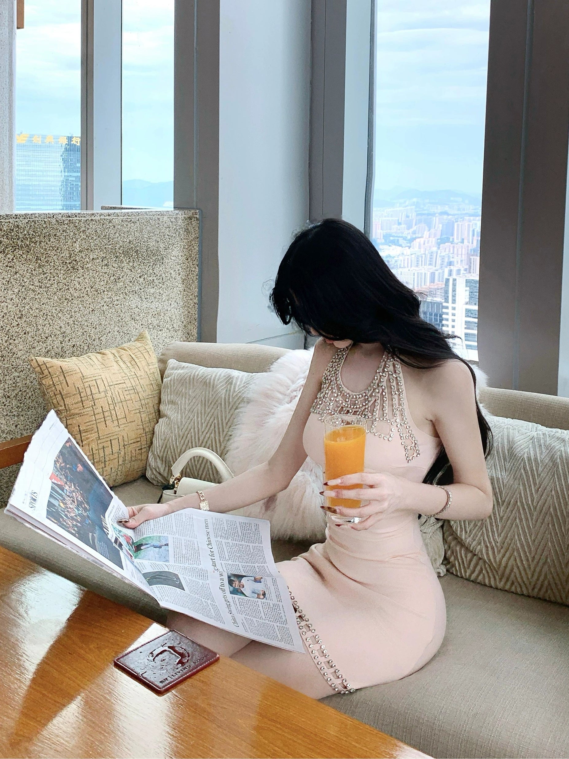 Explore the Sexy Hollow Halter Bodycon Dress at Sanhoostudio, a French-inspired cut-out design for a bold and stylish autumn look.