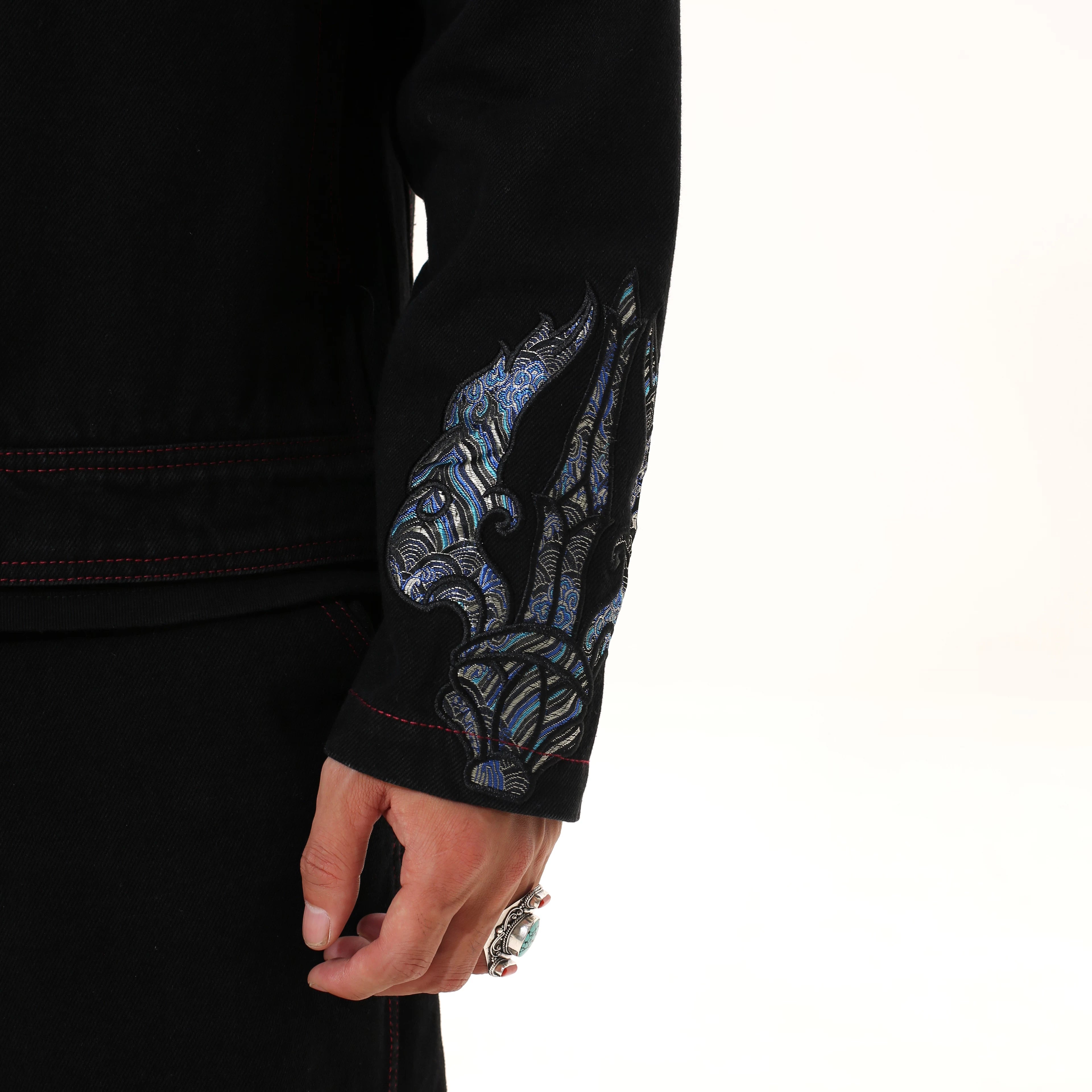 Sanhoostudio denim jacket featuring Vajra embroidery and a relaxed streetwear silhouette. Designed for unisex wear with durable denim fabric for fall styling.