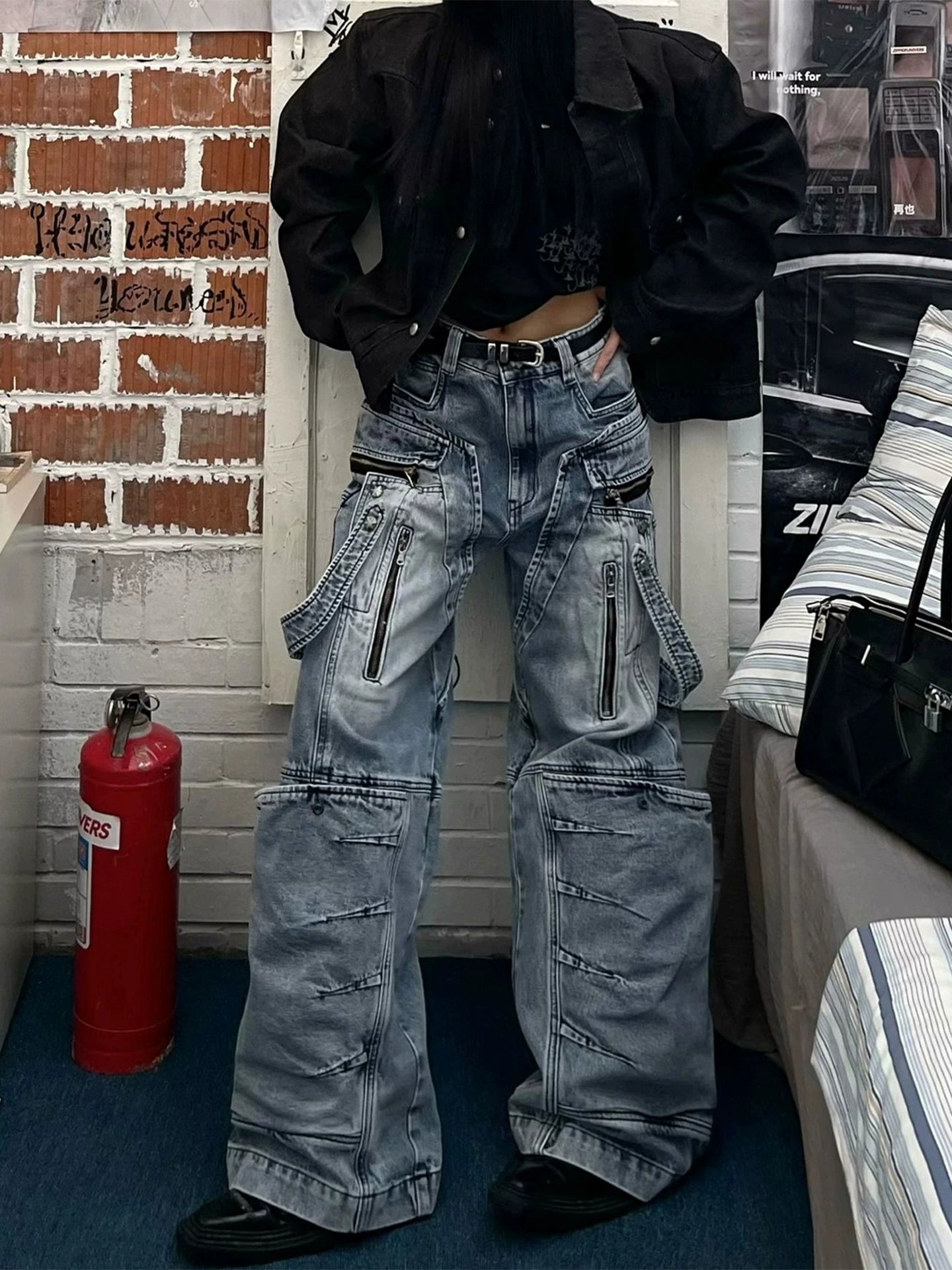 These heavy-duty cargo pants from Sanhoostudio combine deconstructed patchwork with multi-pocket functionality, delivering rugged streetwear style in a wide-leg floor-length cut. A bold fashion-forward piece.