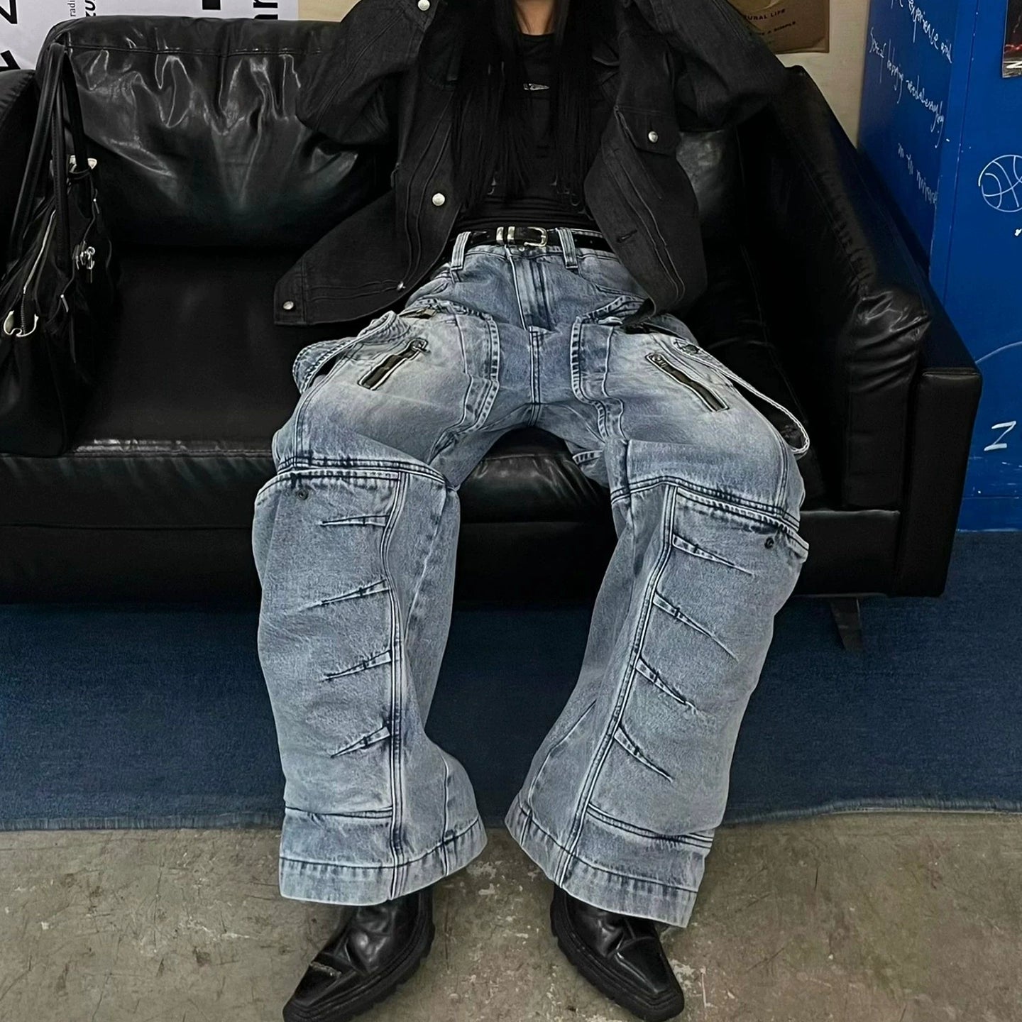 These heavy-duty cargo pants from Sanhoostudio combine deconstructed patchwork with multi-pocket functionality, delivering rugged streetwear style in a wide-leg floor-length cut. A bold fashion-forward piece.