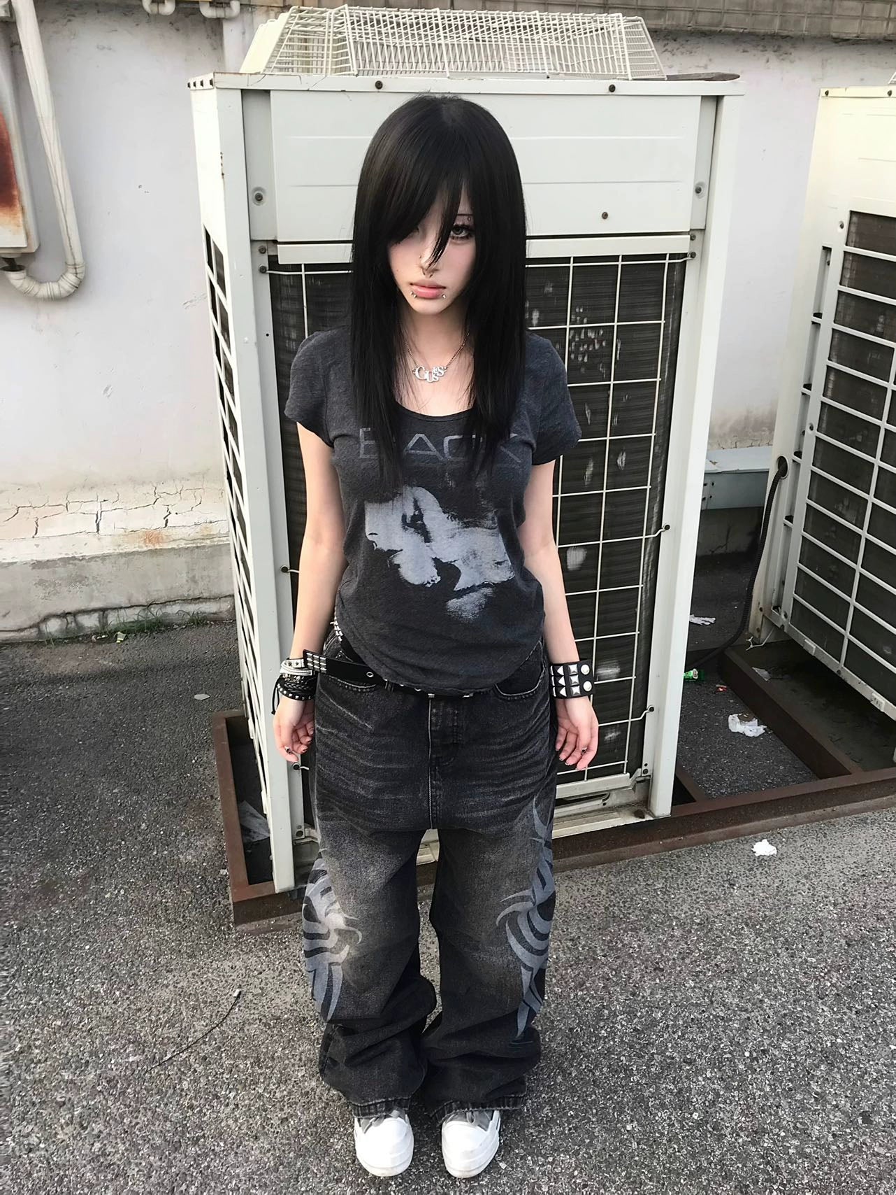 These Sanhoostudio jeans showcase bold totem rune prints across a wide-leg straight cut. The oversized fit and retro wash add cultural inspiration to streetwear, making them a unique fashion-forward piece.