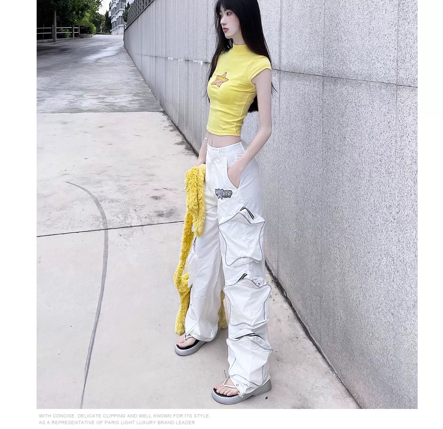 These reflective cargo pants from Sanhoostudio feature 3D star patches and bold avant-garde styling. The oversized fit and dark aesthetic make them ideal for nightwear, performance looks, or urban outfits, blending futuristic energy with functional streetwear practicality.