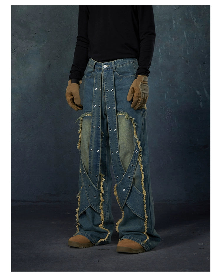 These Sanhoostudio jeans feature heavy deconstruction with strap patchwork, raw edges, and a vintage washed finish. Their oversized straight-leg silhouette adds a rugged, rebellious feel, blending avant-garde design with high street attitude.