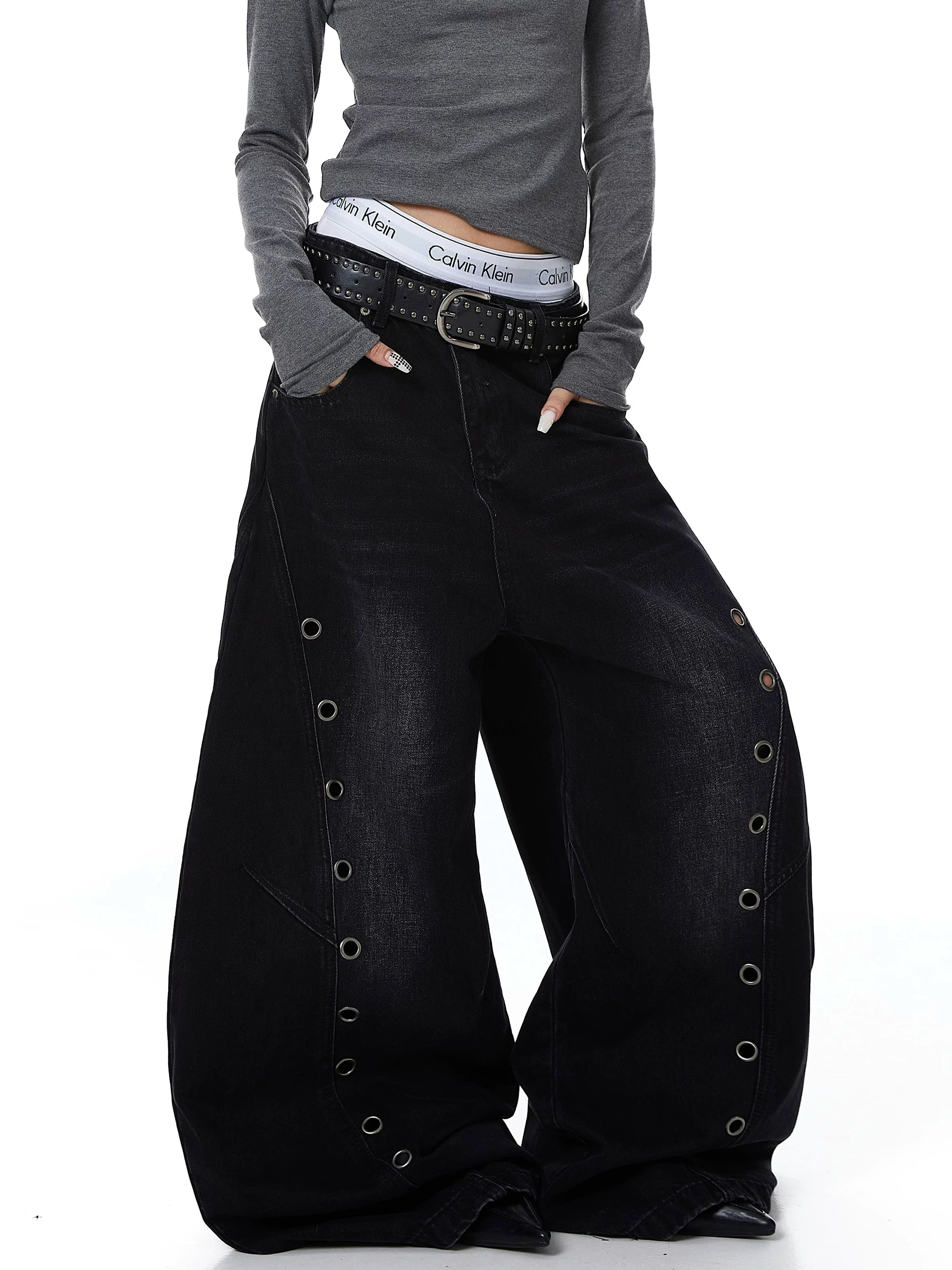 Sanhoostudio wide leg denim pants featuring cut-out structure and metal ring details. A bold deconstructed streetwear piece with distressed finish.