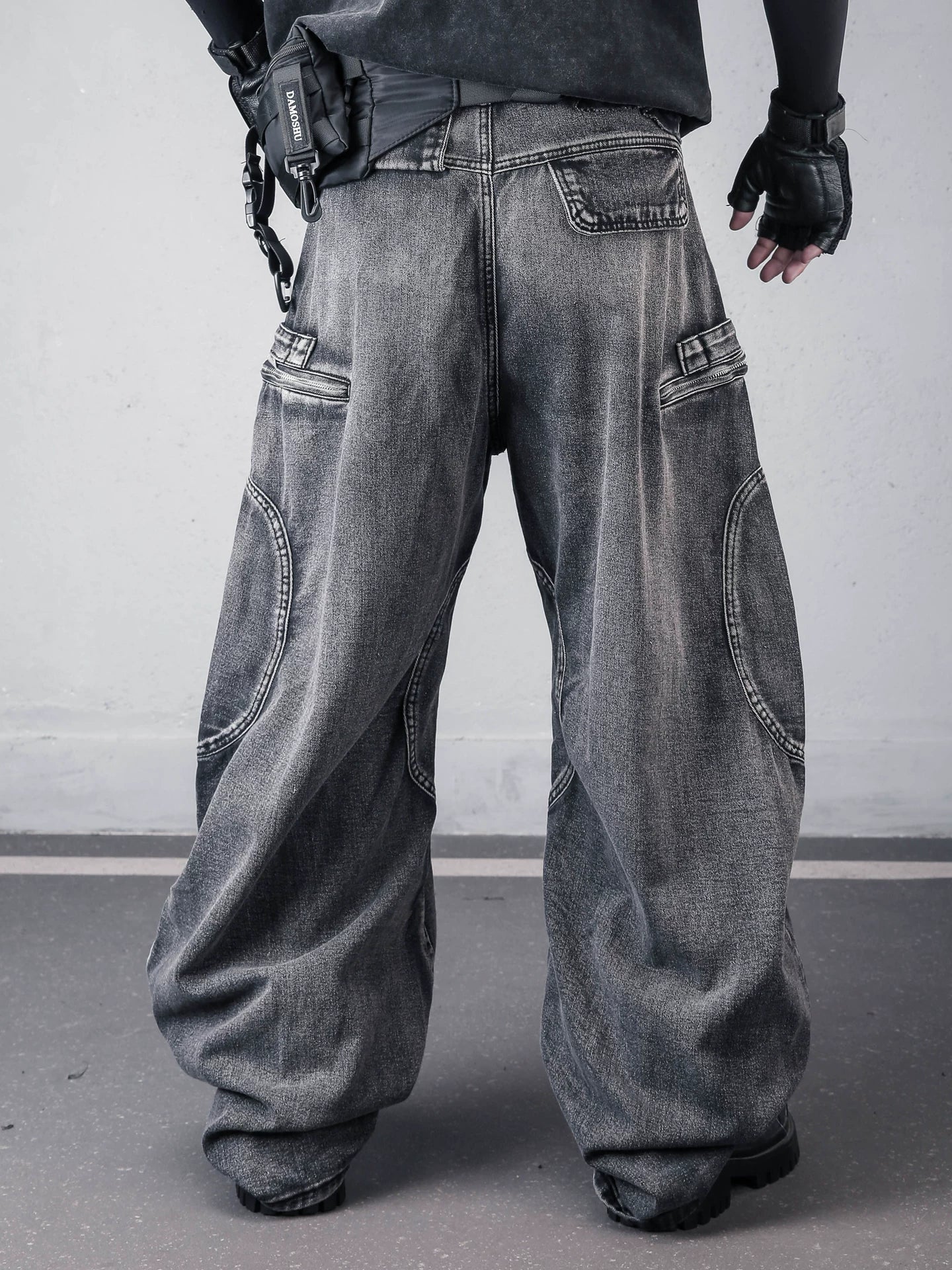 Sanhoostudio denim cargo pants featuring deconstructed design, multi-pocket construction, and scythe-cut wide leg silhouette. Built for functional streetwear styling with durability, comfort, and a strong urban utility look.