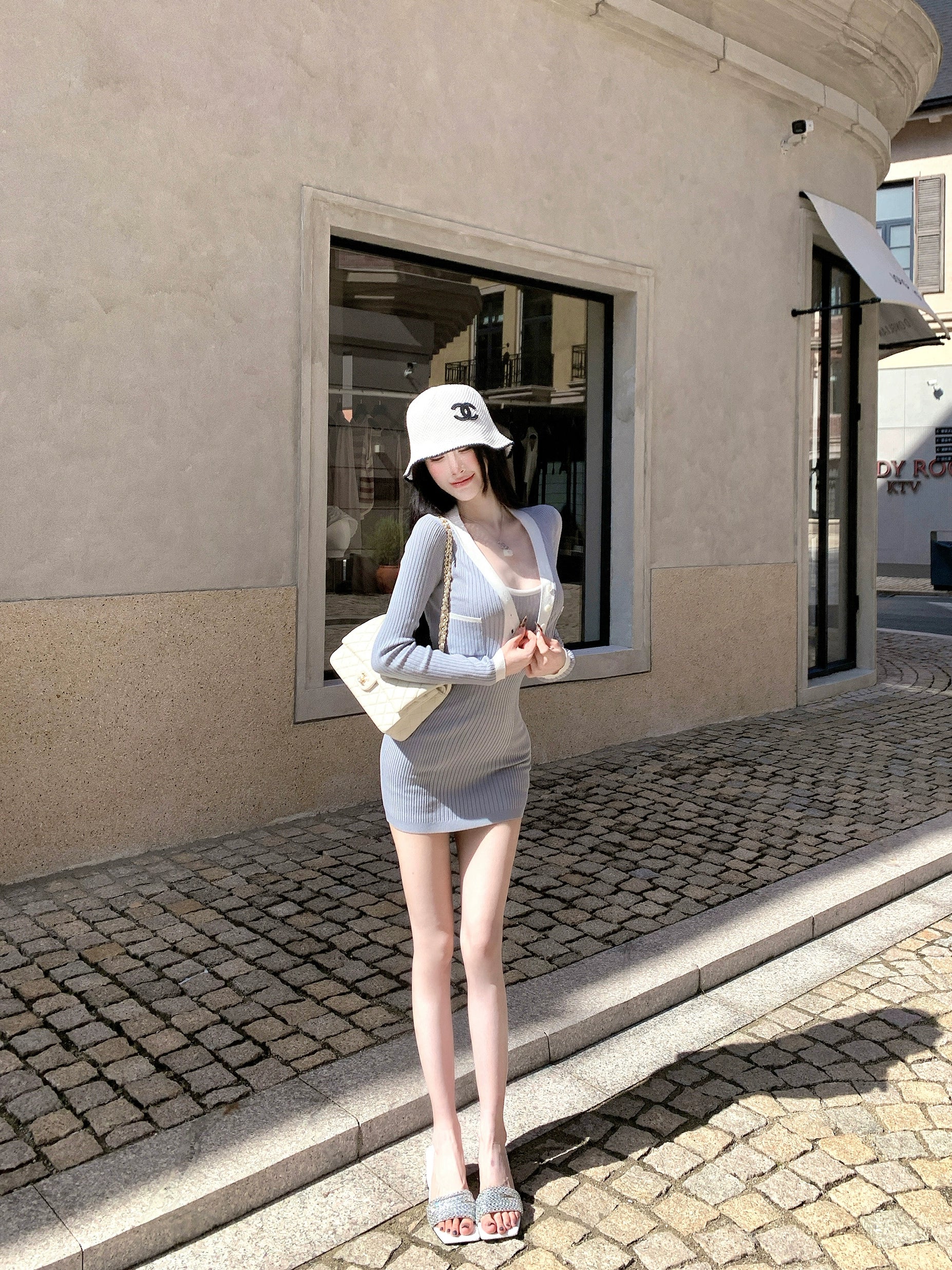 Sanhoostudio presents the Knit Cardigan Dress Set, a fashionable two-piece combining comfort and elegance for effortless autumn wear.