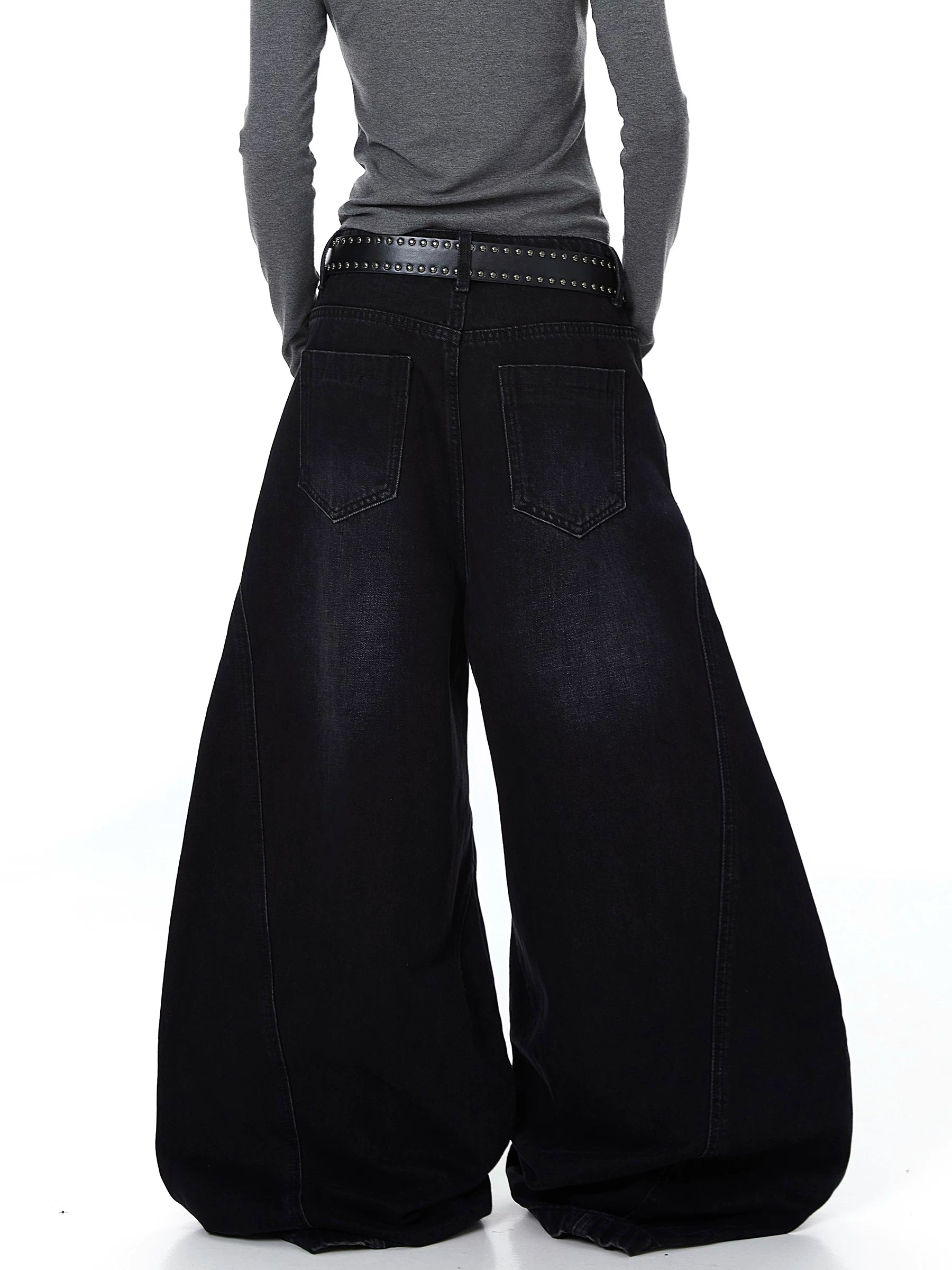 Sanhoostudio wide leg denim pants featuring cut-out structure and metal ring details. A bold deconstructed streetwear piece with distressed finish.