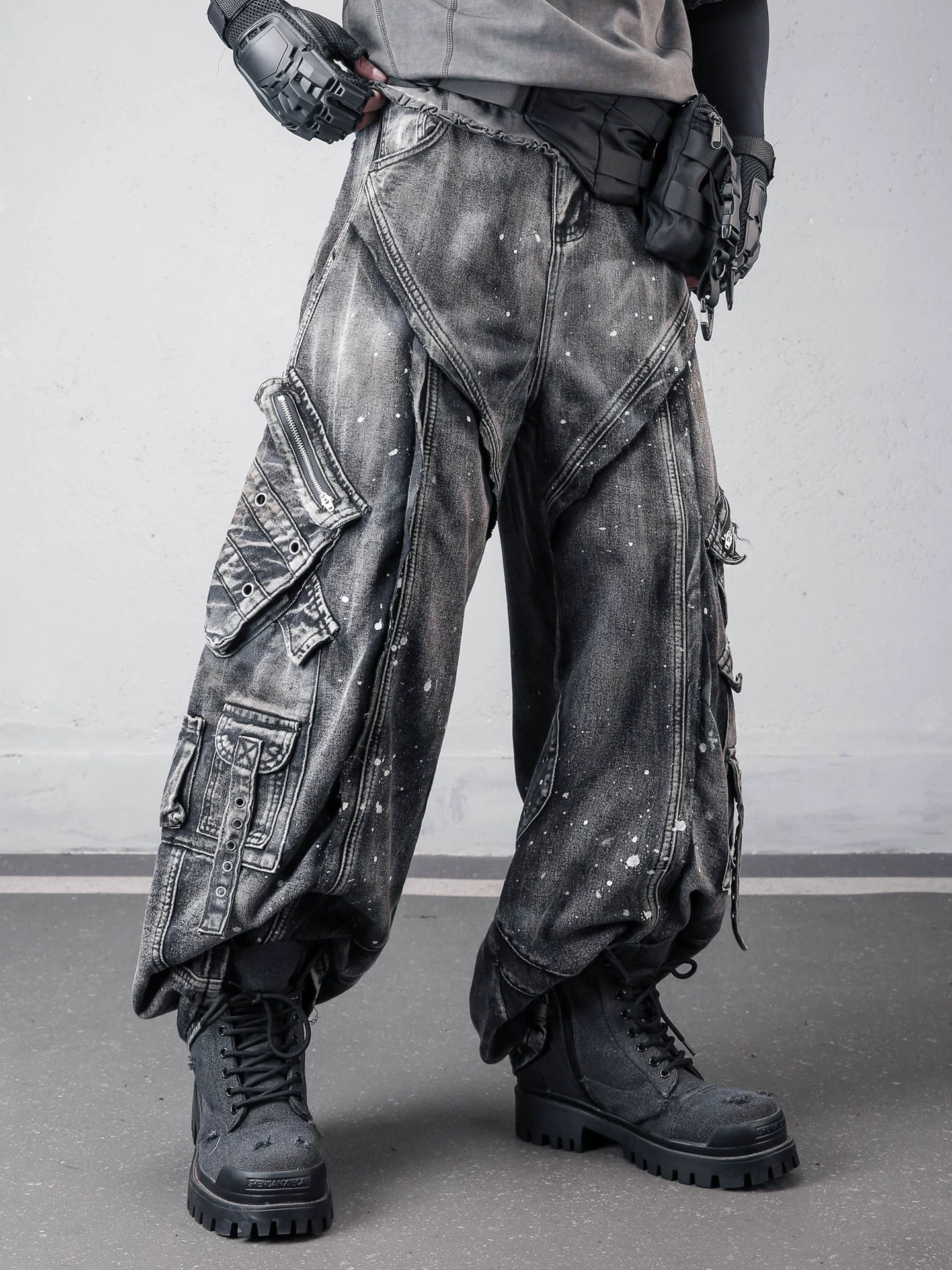 Sanhoostudio denim pants featuring paint splatter finish, multi-pocket design, and wide leg silhouette. Built for bold streetwear styling with a rugged aesthetic, functional details, and comfortable everyday wear.