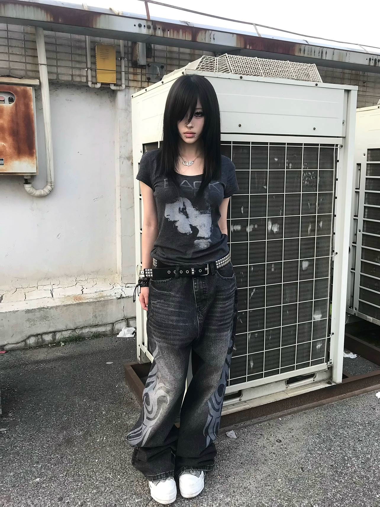 These Sanhoostudio jeans showcase bold totem rune prints across a wide-leg straight cut. The oversized fit and retro wash add cultural inspiration to streetwear, making them a unique fashion-forward piece.