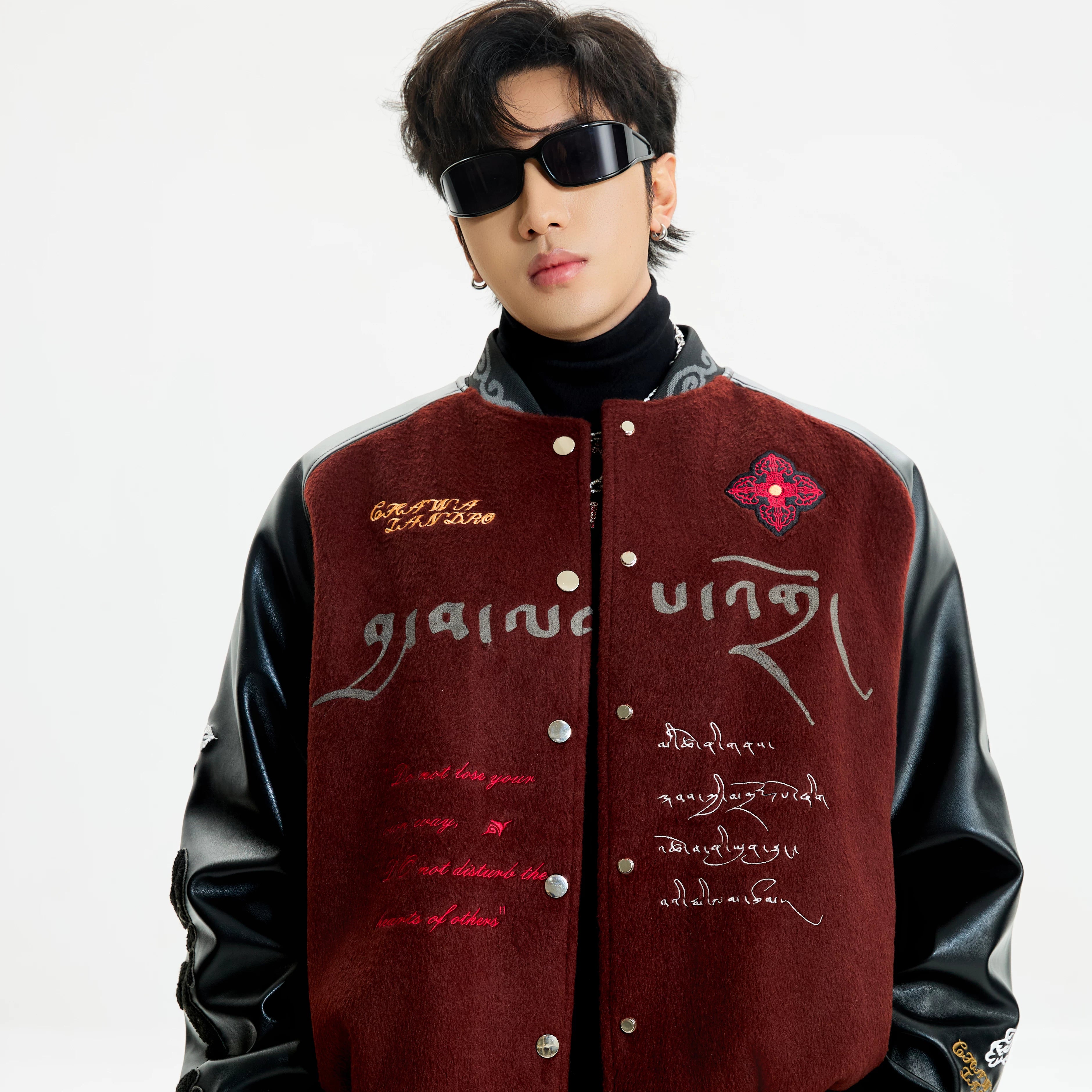 Sanhoostudio padded varsity jacket featuring vintage embroidery and relaxed fit. A unisex winter outerwear essential.