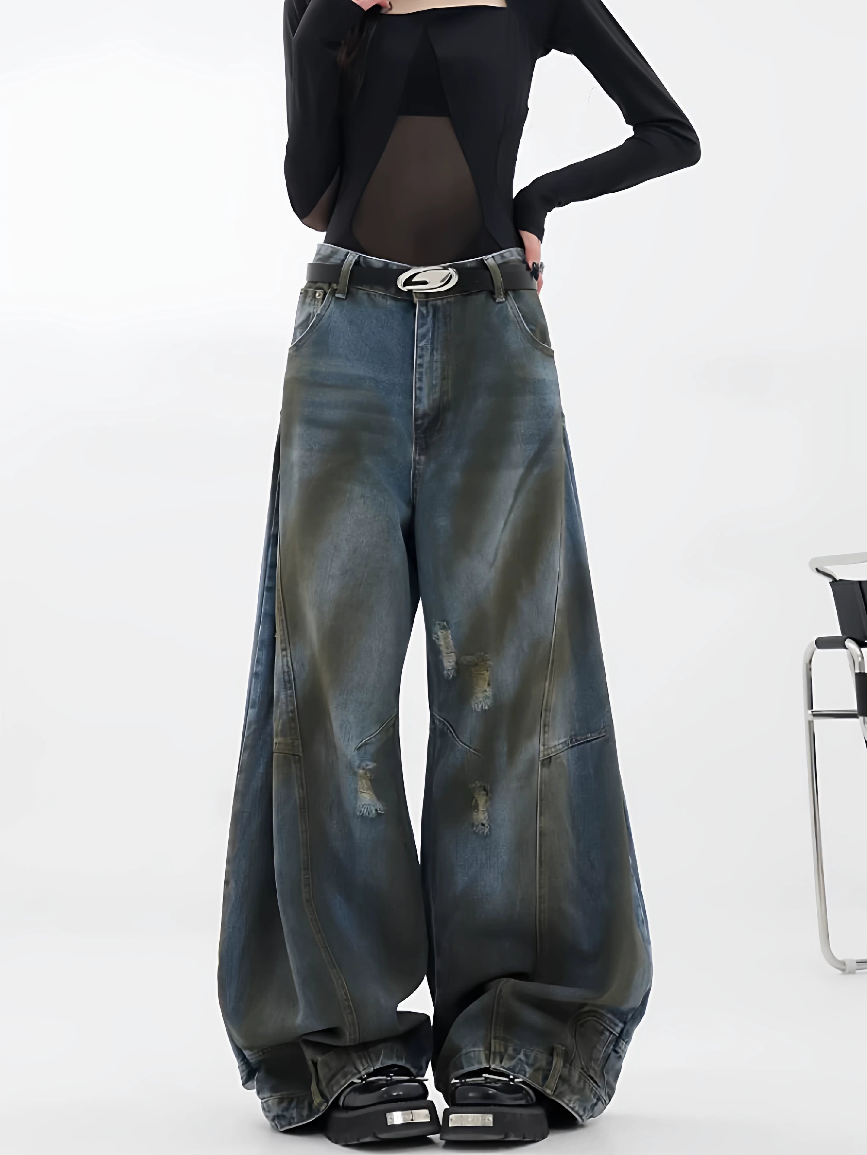Sanhoostudio wide leg jeans featuring reverse panel construction and distressed details. A high street denim piece with bold design character.