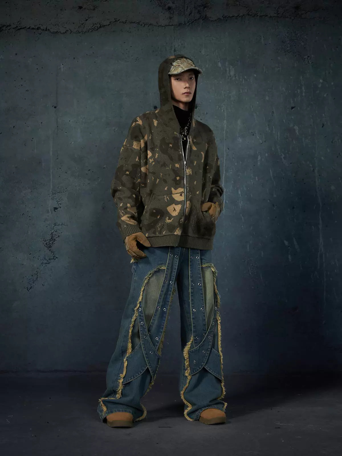 These Sanhoostudio jeans feature heavy deconstruction with strap patchwork, raw edges, and a vintage washed finish. Their oversized straight-leg silhouette adds a rugged, rebellious feel, blending avant-garde design with high street attitude.
