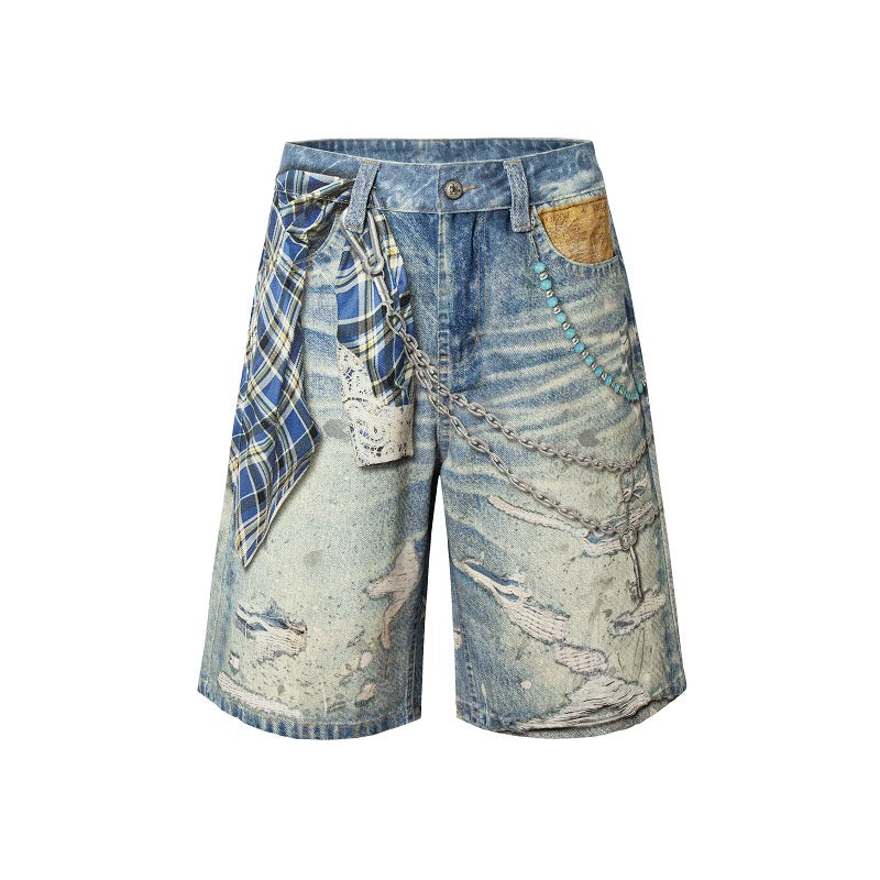 These Sanhoostudio denim shorts feature plaid-inspired patterns with chain print accents, merging casual denim with bold graphic expression. With a relaxed oversized fit, they’re ideal for layering into creative high street looks.