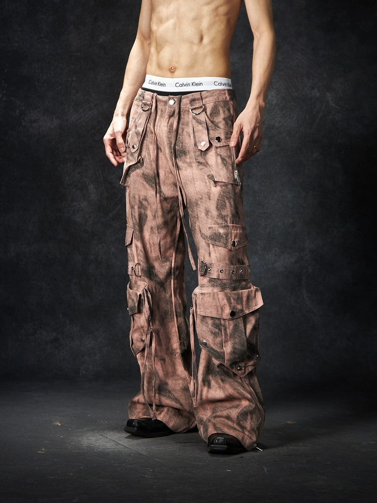 The Sanhoostudio distressed mud-dye cargo pants feature a heavy washed finish, rugged multi-pocket design, and a relaxed straight-leg fit. Perfect for utilitarian and high street styling, they combine functionality with bold design, making them an essential statement for everyday streetwear wardrobes.