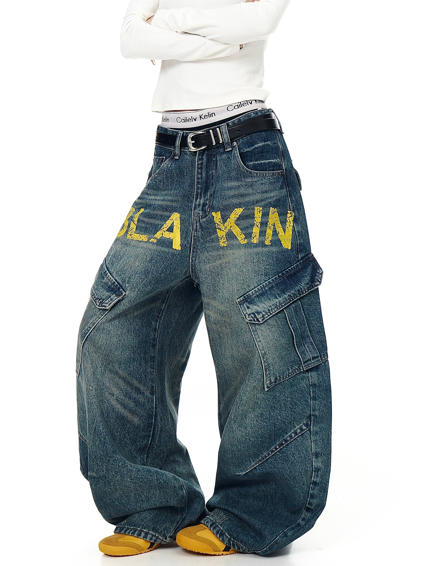 Deconstruction meets functionality in these multi-pocket denim pants. Featuring a unique cut and bold lettering, they channel SanhooStudio’s signature street-lab creativity.