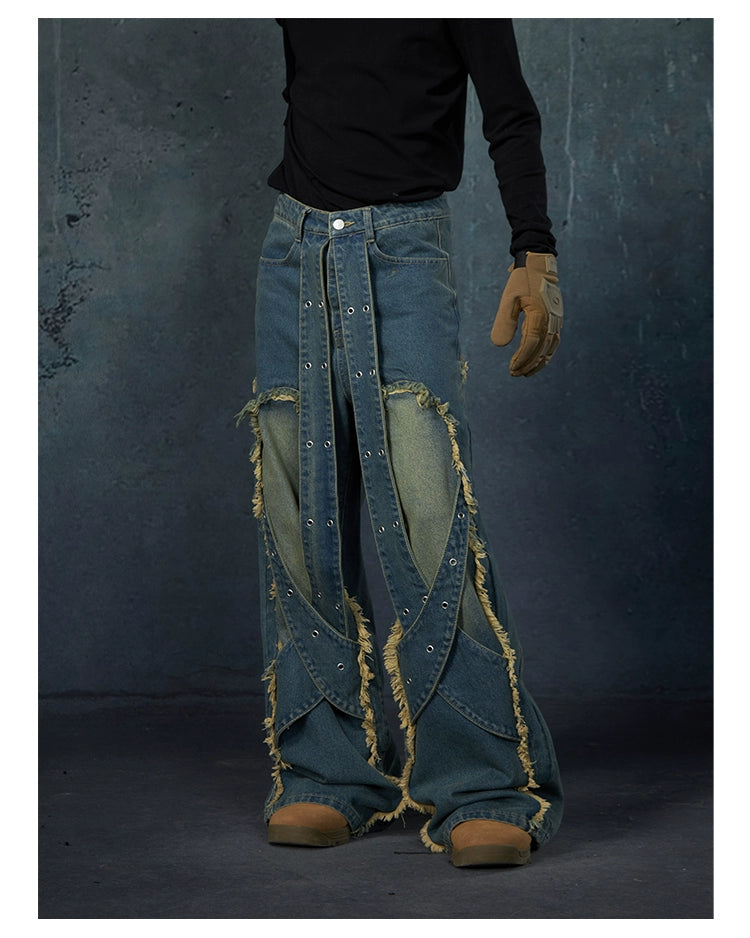 These Sanhoostudio jeans feature heavy deconstruction with strap patchwork, raw edges, and a vintage washed finish. Their oversized straight-leg silhouette adds a rugged, rebellious feel, blending avant-garde design with high street attitude.