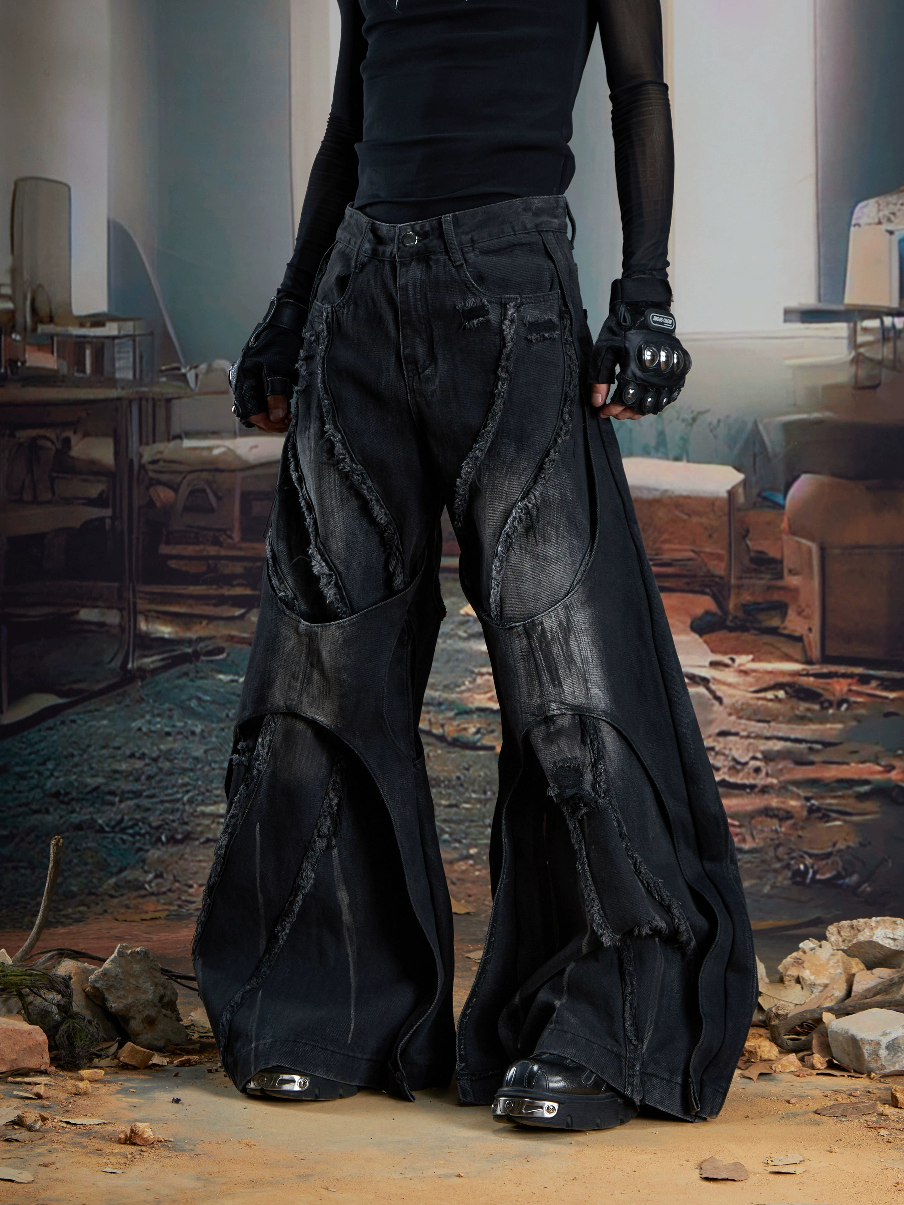 Dual-layer spliced jeans with frayed tassels, washed fading, and wide-leg construction. Sanhoostudio’s dark heavy-duty street aesthetic.
