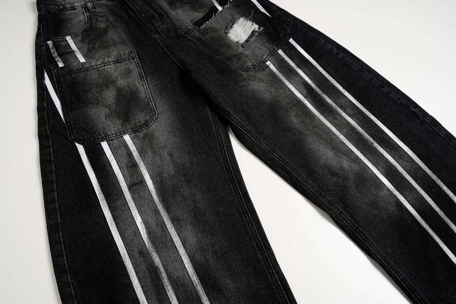 These dirty-dyed washed jeans feature bold stripe accents, multiple utility pockets, and a vintage worn-in finish. With a loose, streetwear-inspired fit, they’re perfect for creating a rugged, edgy look. Ideal for urban and grunge fashion lovers.