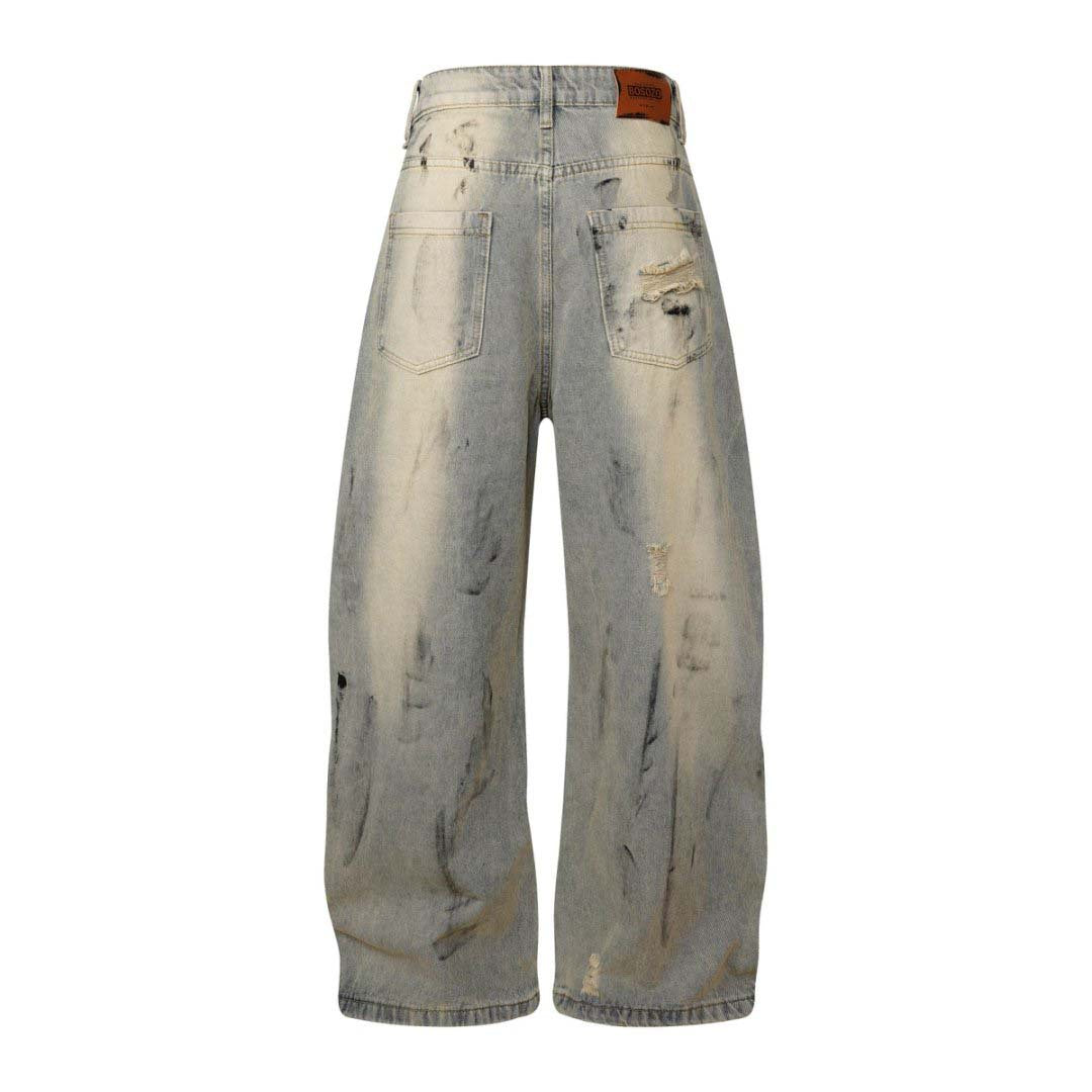 These dirty-dyed washed jeans feature bold stripe accents, multiple utility pockets, and a vintage worn-in finish. With a loose, streetwear-inspired fit, they’re perfect for creating a rugged, edgy look. Ideal for urban and grunge fashion lovers.