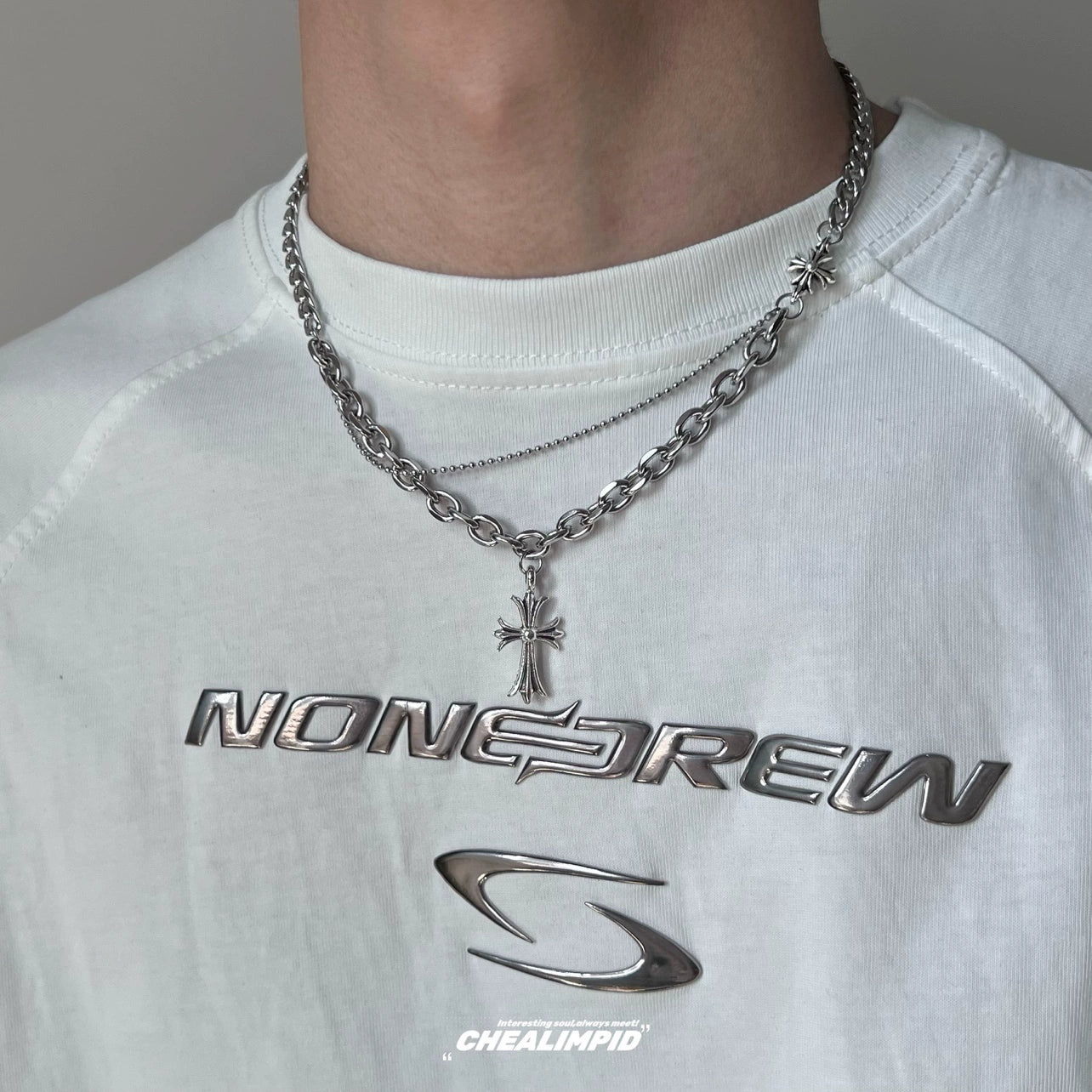 Discover Sanhoostudio’s cross double-layer titanium necklace—sturdy titanium construction paired with layered chains for a versatile unisex accessory suitable for casual and dressy street looks.