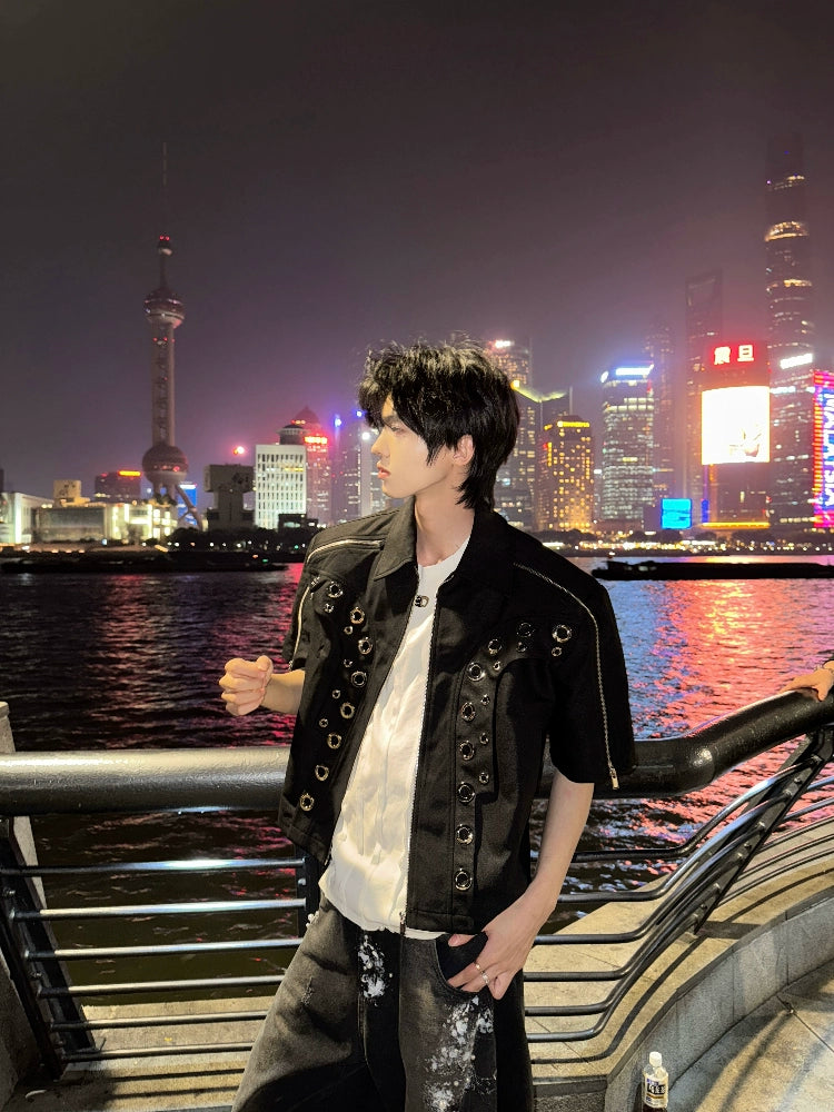 This avant-garde cropped jacket by Sanhoostudio showcases futuristic hollow-metal inspired cutouts with bold shoulder pads. Its oversized silhouette, lightweight material, and modern edge make it a standout layering piece for streetwear fans who embrace unique design and cutting-edge style.