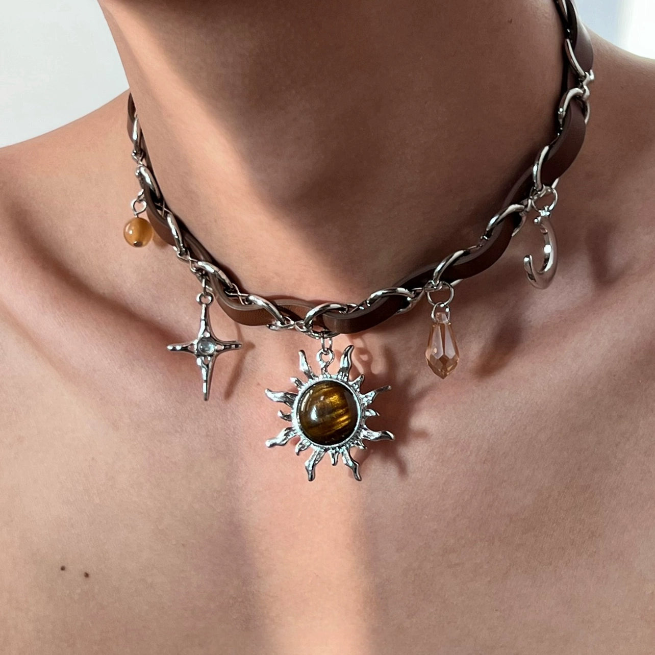 Sanhoostudio’s Mallard brown sunburst choker necklace showcases a bold sun-inspired design with warm brown tones, perfect for fashion-forward individuals seeking a standout, retro-luxe accessory.