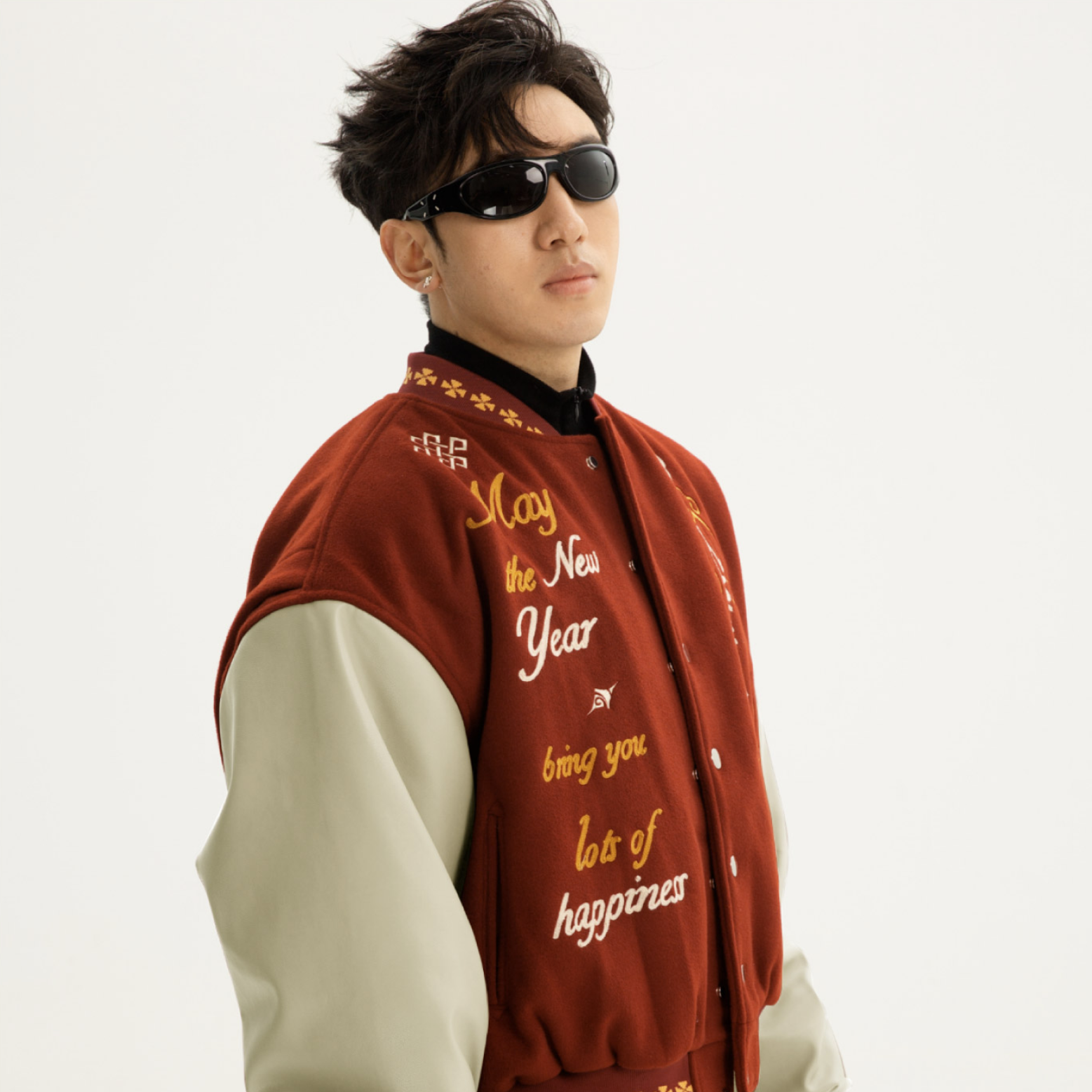 Sanhoostudio varsity jacket with patchwork construction and embroidery. A unisex retro-inspired streetwear outerwear piece.