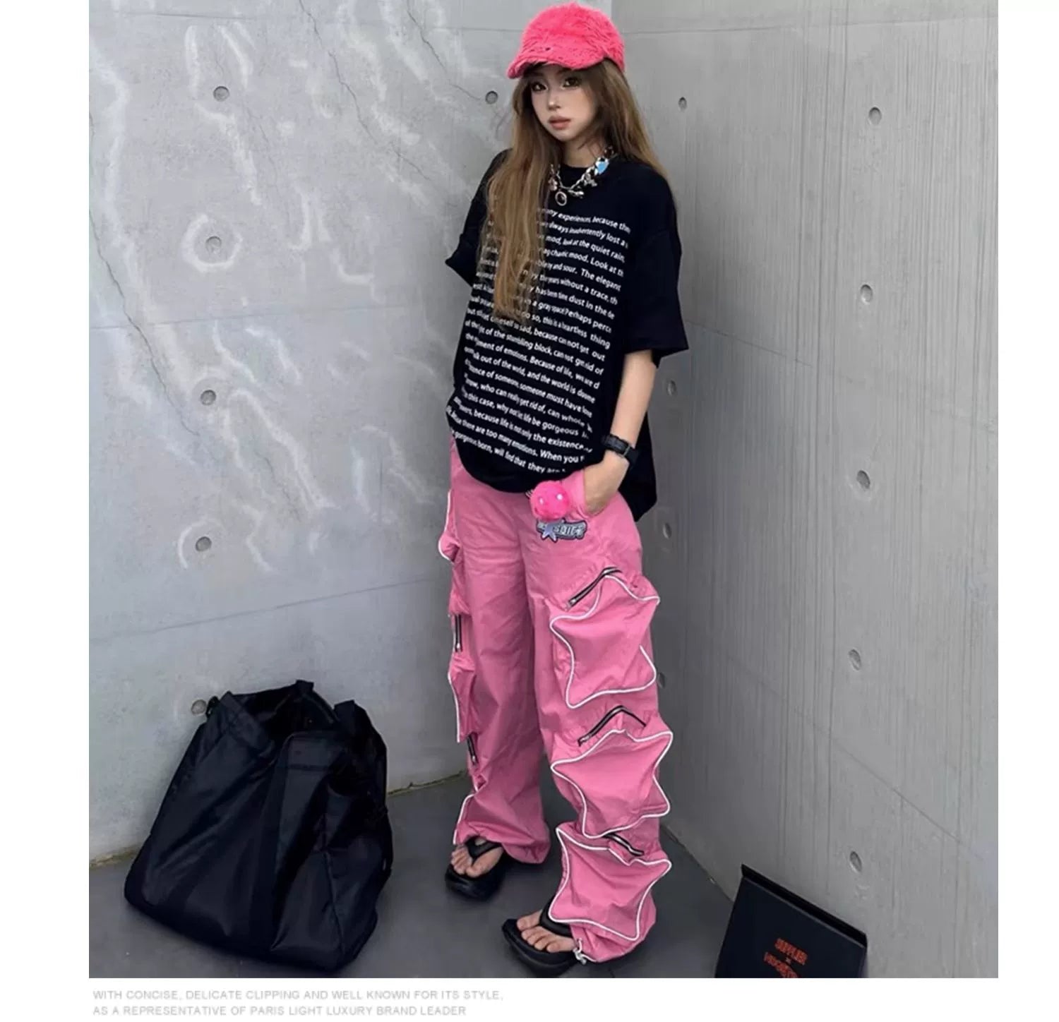 These reflective cargo pants from Sanhoostudio feature 3D star patches and bold avant-garde styling. The oversized fit and dark aesthetic make them ideal for nightwear, performance looks, or urban outfits, blending futuristic energy with functional streetwear practicality.