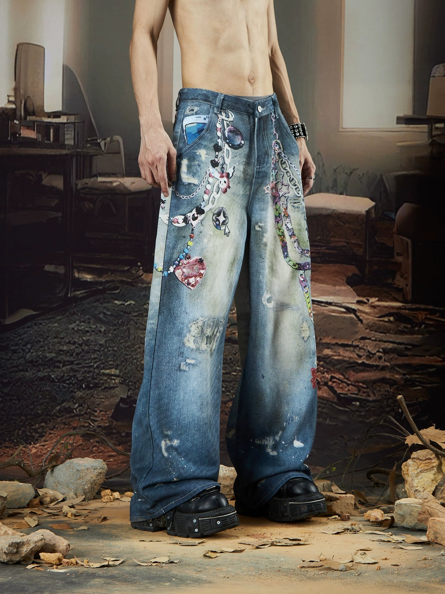 The Sanhoostudio jeans combine digital multicolor chain prints with a washed distressed finish in a straight-leg silhouette. Their oversized cut and bold pattern make them an expressive statement piece for modern streetwear outfits.