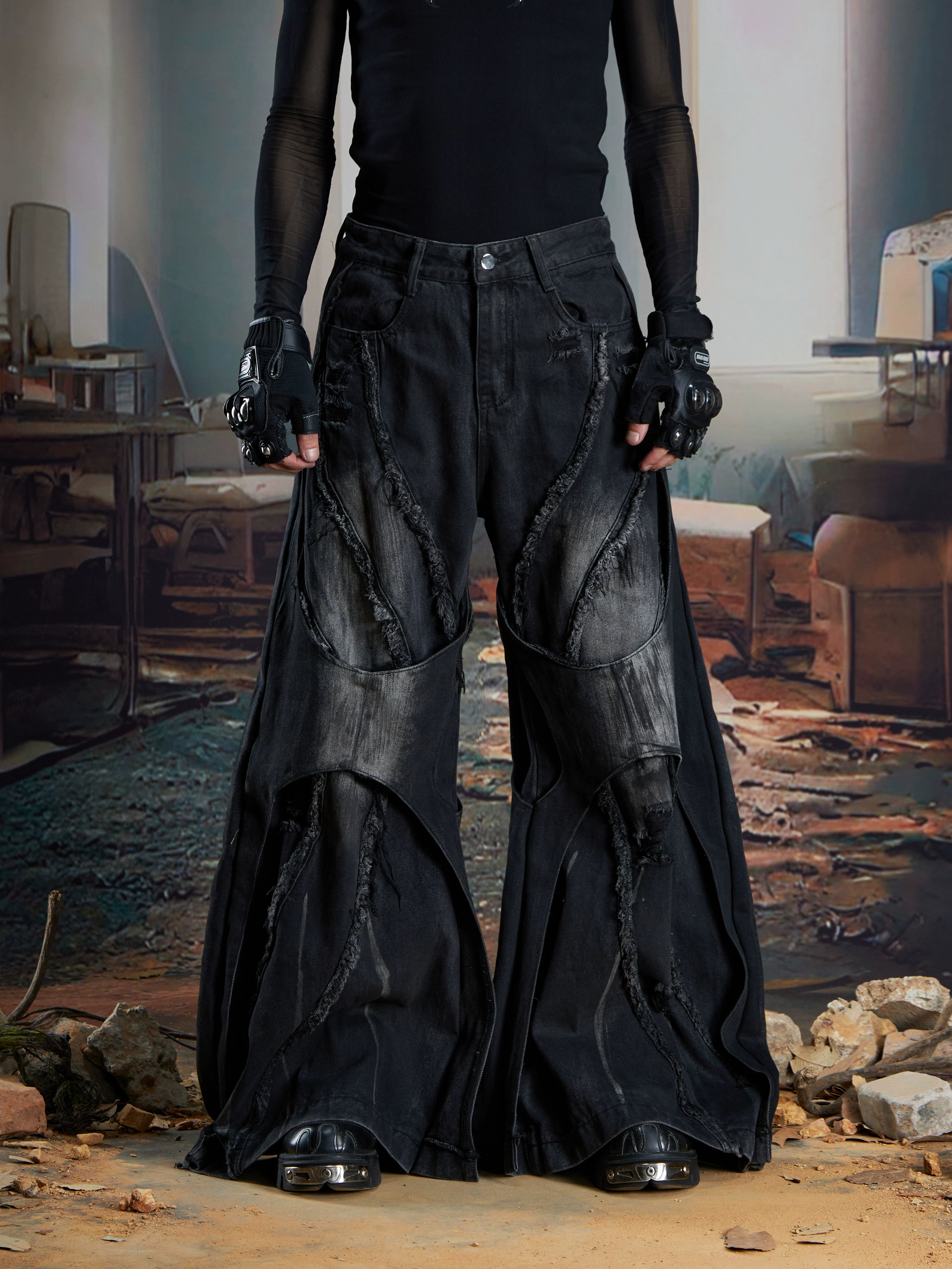 Dual-layer spliced jeans with frayed tassels, washed fading, and wide-leg construction. Sanhoostudio’s dark heavy-duty street aesthetic.
