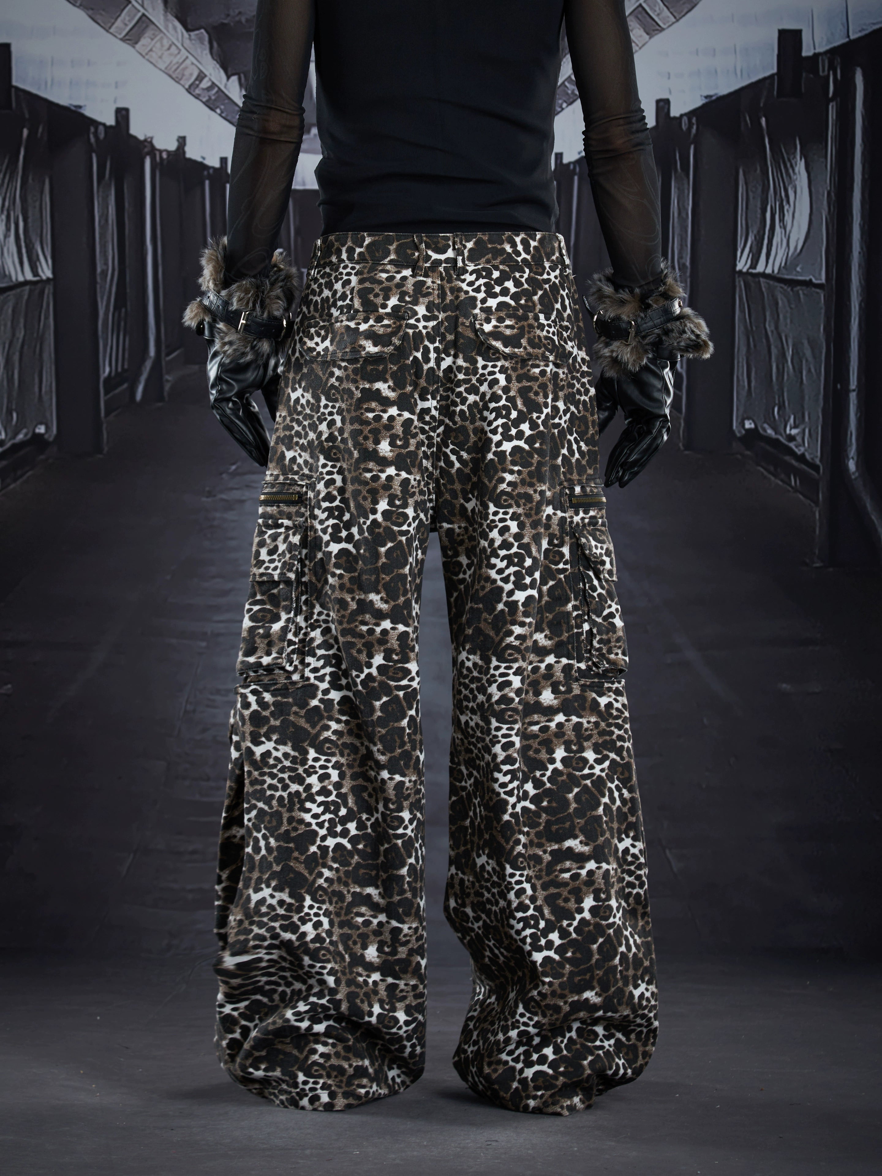 Dark punk-inspired straight cargo pants featuring pleated structure, oversized multi-pocket utility, and a bold leopard pattern. A statement unisex streetwear essential from Sanhoostudio.