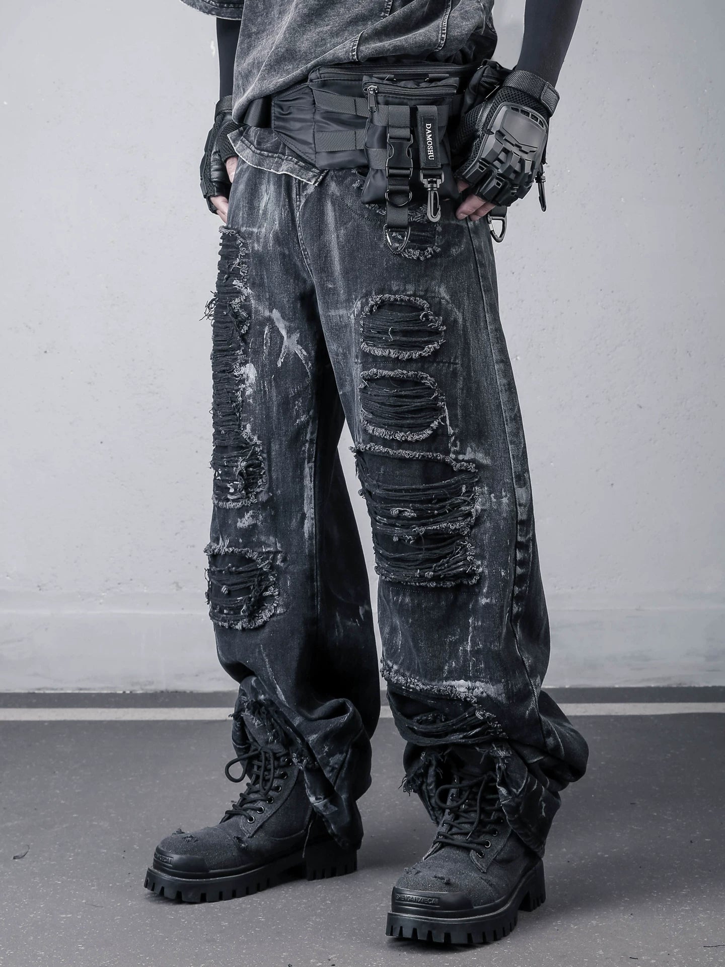 Sanhoostudio wide leg denim pants featuring distressed wash, painted effect, and ripped detailing. Designed with a scythe-cut silhouette for bold streetwear outfits, combining comfort, texture, and everyday versatility.