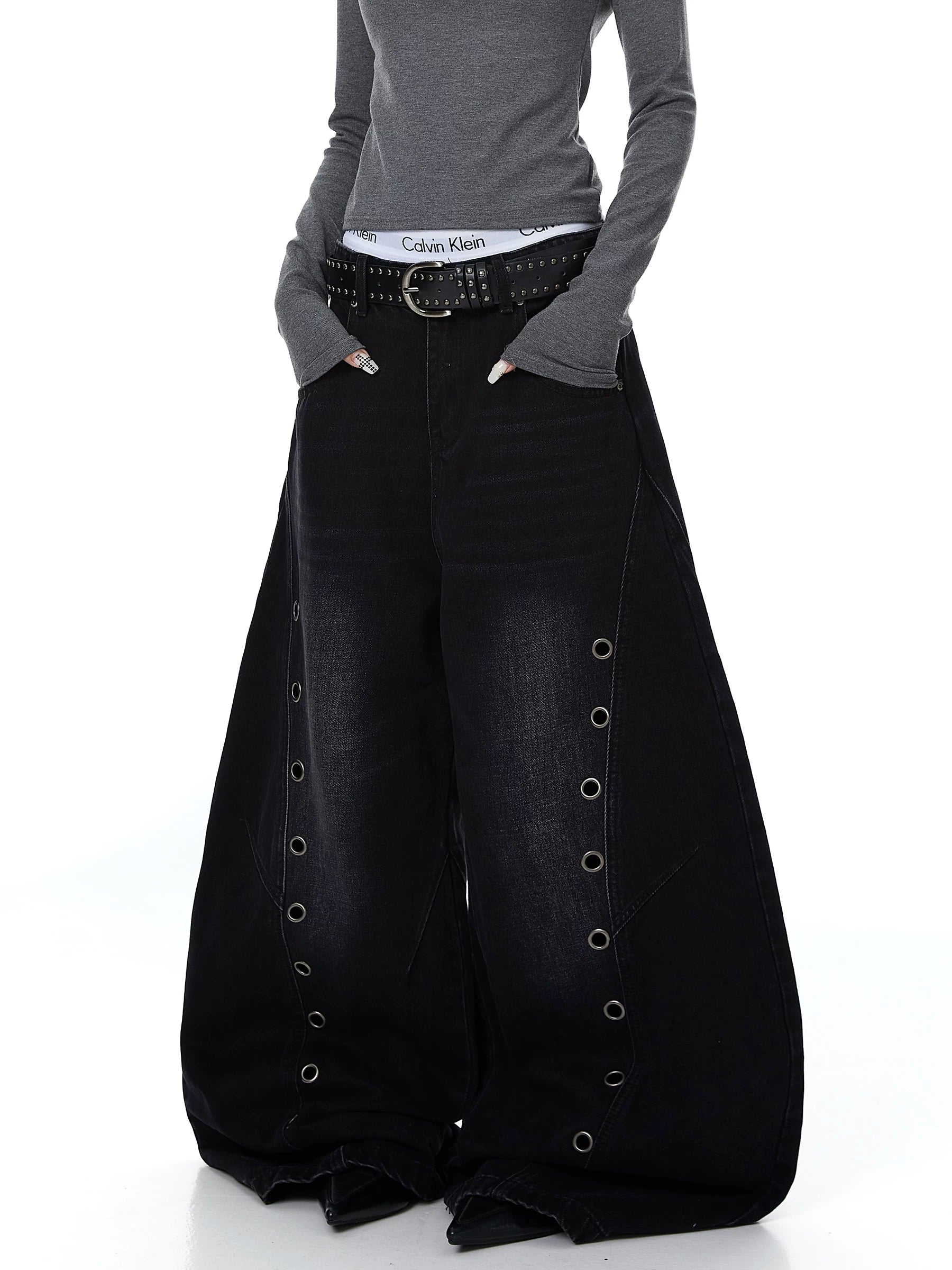 Sanhoostudio wide leg denim pants featuring cut-out structure and metal ring details. A bold deconstructed streetwear piece with distressed finish.