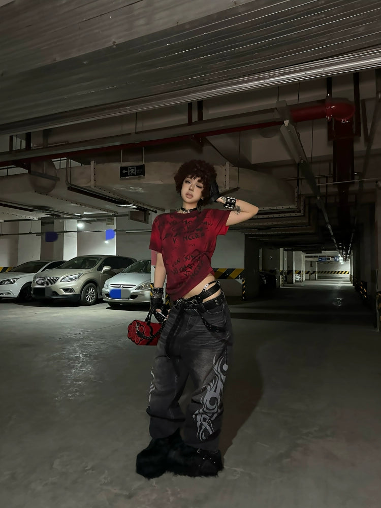 These Sanhoostudio jeans showcase bold totem rune prints across a wide-leg straight cut. The oversized fit and retro wash add cultural inspiration to streetwear, making them a unique fashion-forward piece.
