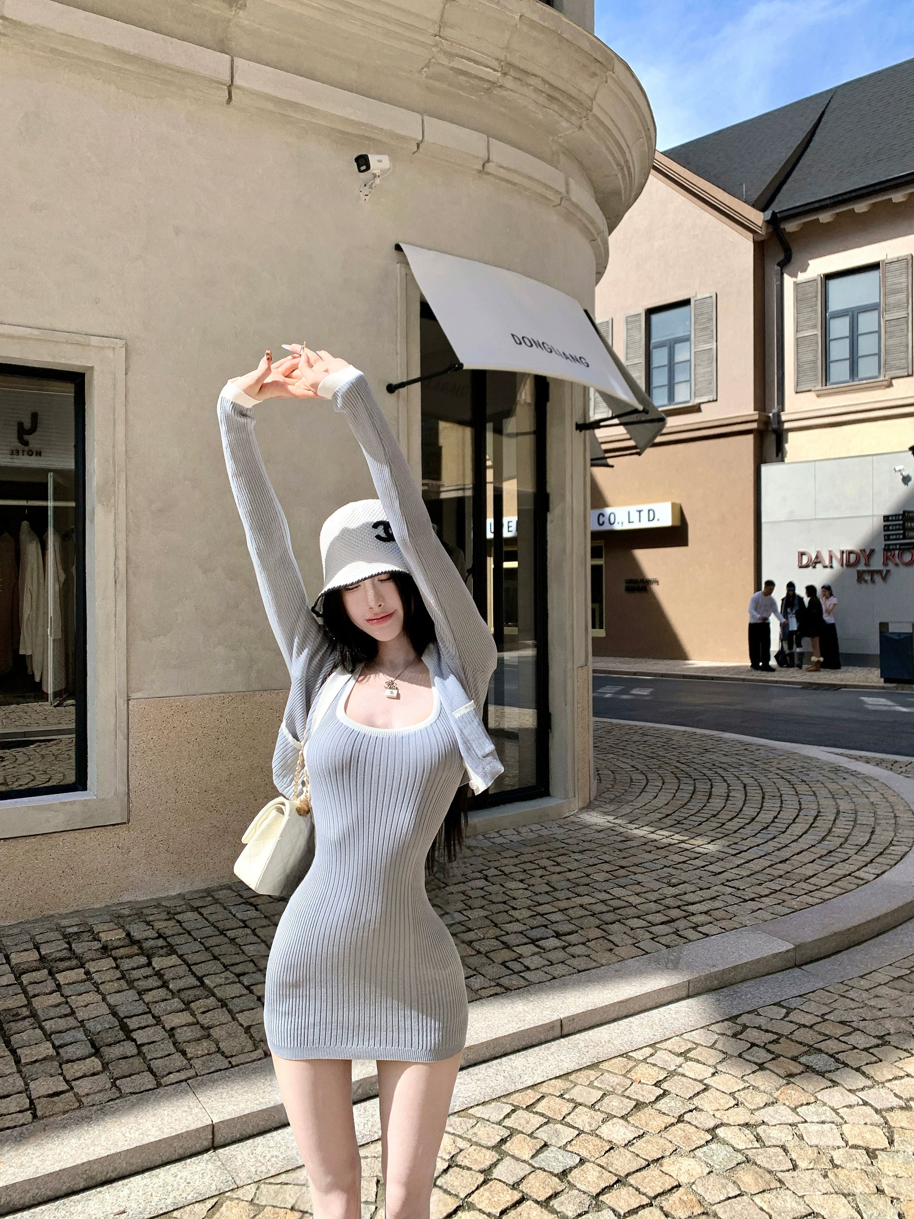 Sanhoostudio presents the Knit Cardigan Dress Set, a fashionable two-piece combining comfort and elegance for effortless autumn wear.