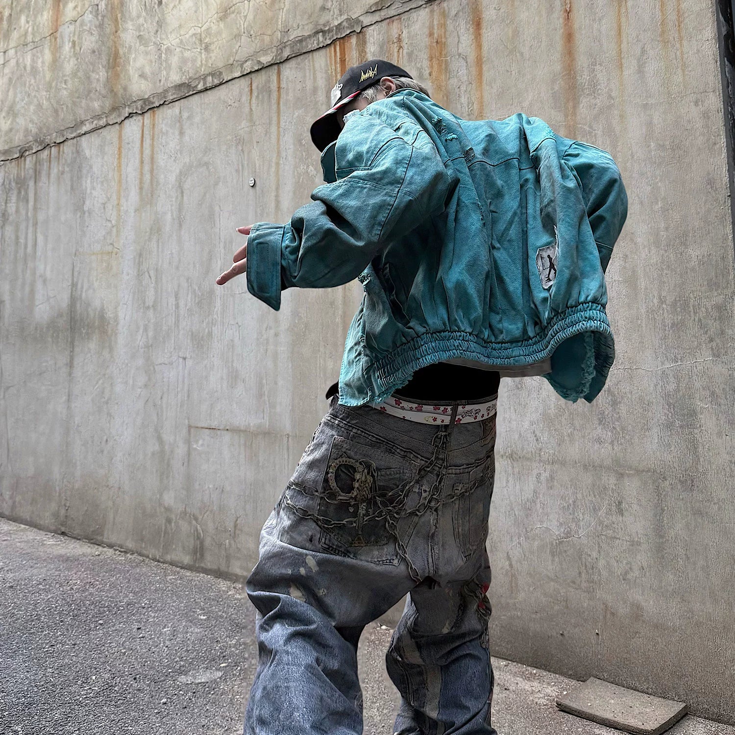 Sanhoostudio vintage-inspired canvas jacket crafted from 100% cotton. Featuring patchwork distressing, dyed finish, and a structured oversized fit that defines modern denim street style for all genders.