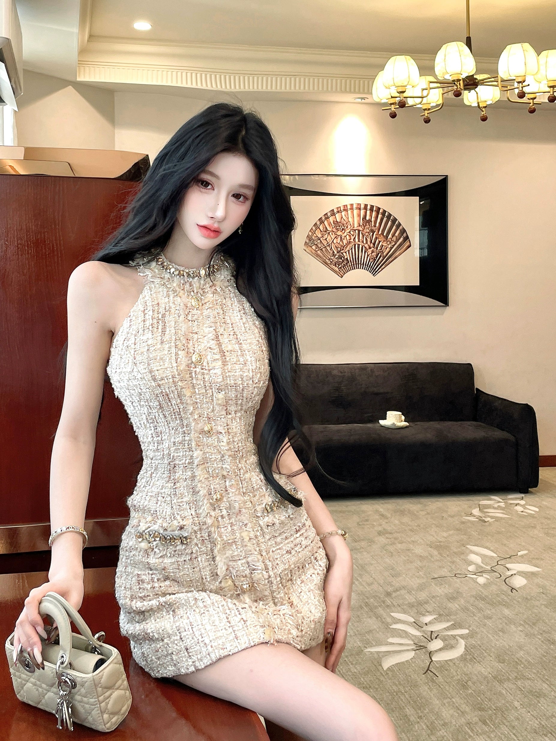 Sanhoostudio presents the Chic Tweed Halter Bodycon Dress, a luxurious piece with refined textures, blending modern charm with timeless elegance.