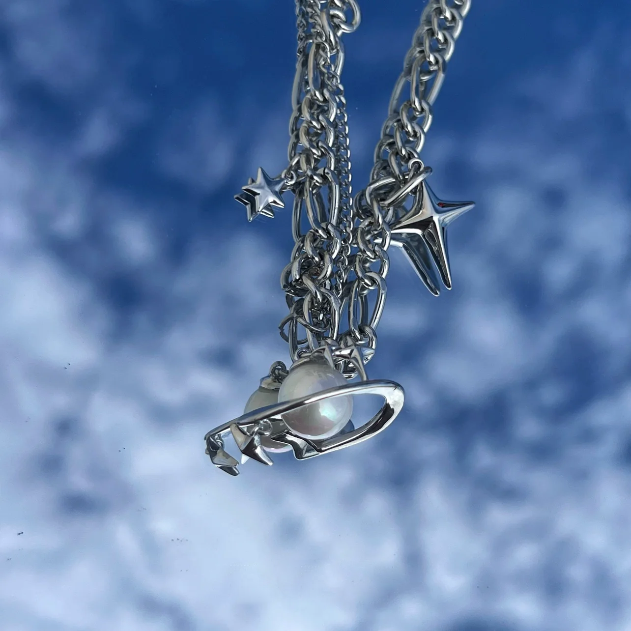 Discover the star geometric pearl layered necklace from Sanhoostudio, designed with chic pearl details and modern double chain style. Perfect for layering with streetwear or luxury outfits. Shop necklaces now at Sanhoostudio.