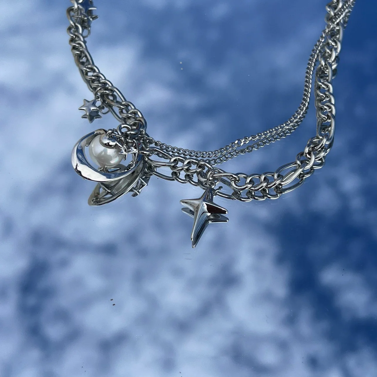 Discover the star geometric pearl layered necklace from Sanhoostudio, designed with chic pearl details and modern double chain style. Perfect for layering with streetwear or luxury outfits. Shop necklaces now at Sanhoostudio.