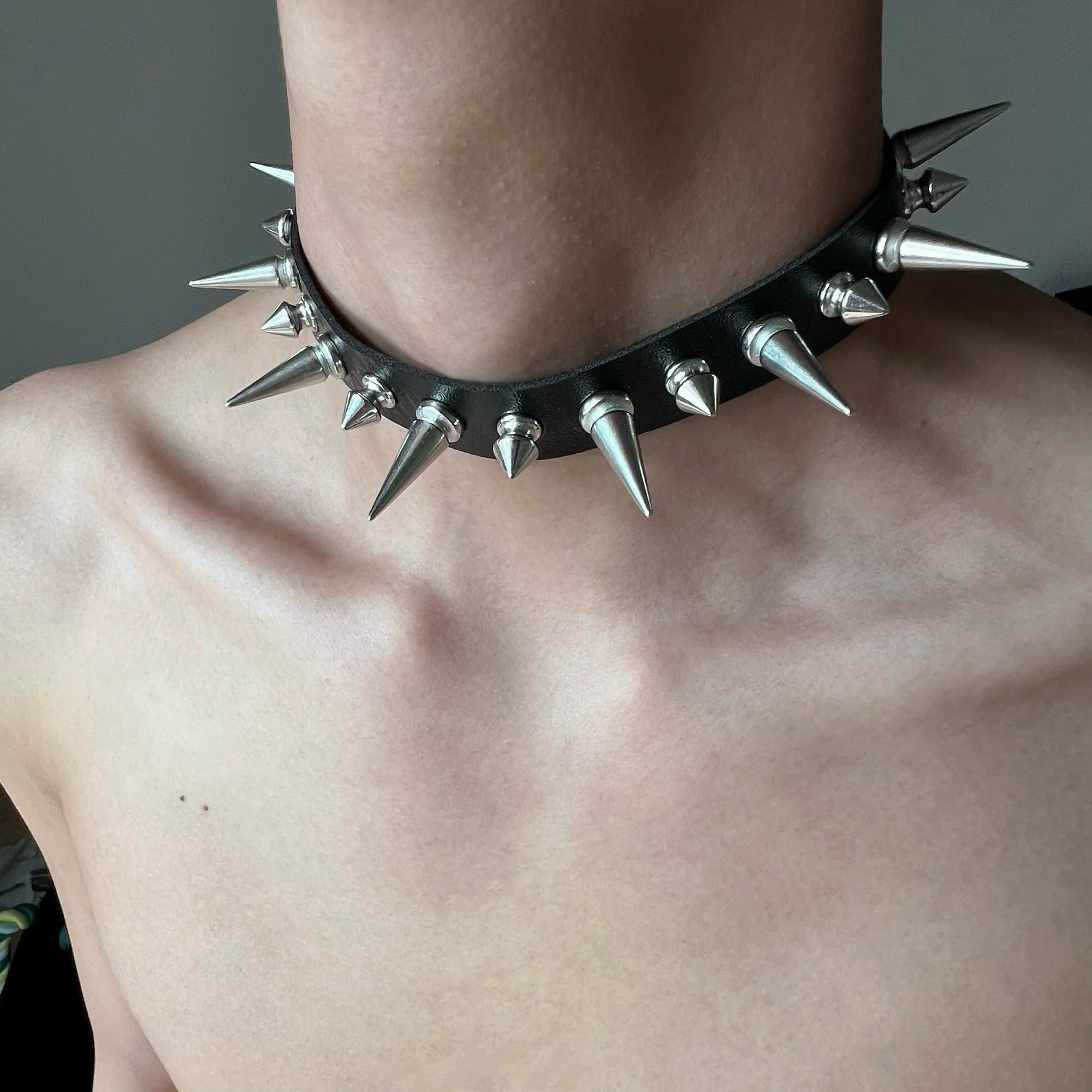 Discover Sanhoostudio’s rock studded punk leather choker, blending Y2K subculture aesthetics with bold metal detailing for a rebellious, fashion-forward accessory that elevates streetwear outfits.