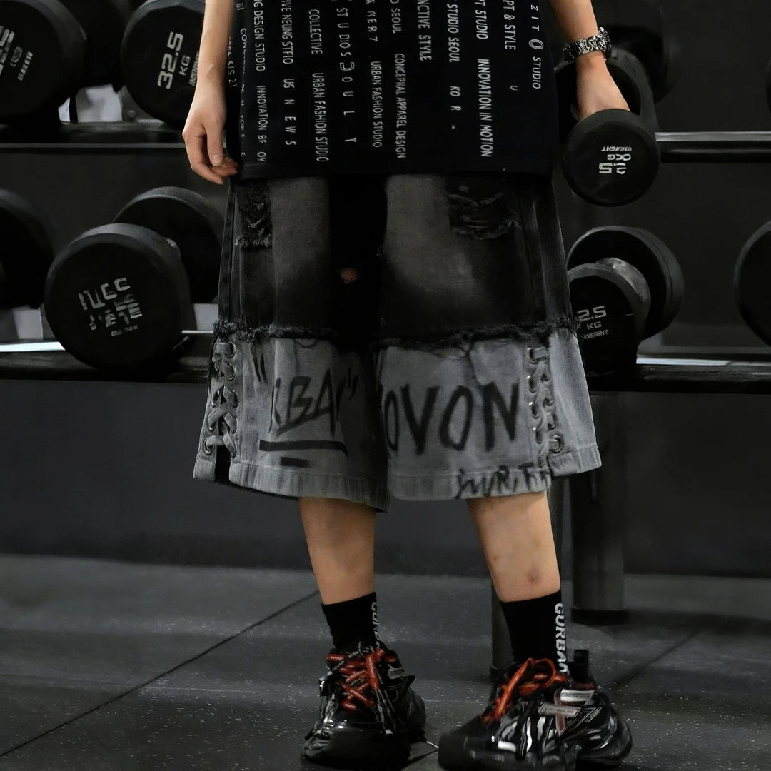 Sanhoostudio sleeveless T-shirt featuring distressed detailing, red spray-print artwork, and a relaxed oversized fit. Designed for summer streetwear styling with breathable comfort and a bold urban aesthetic.