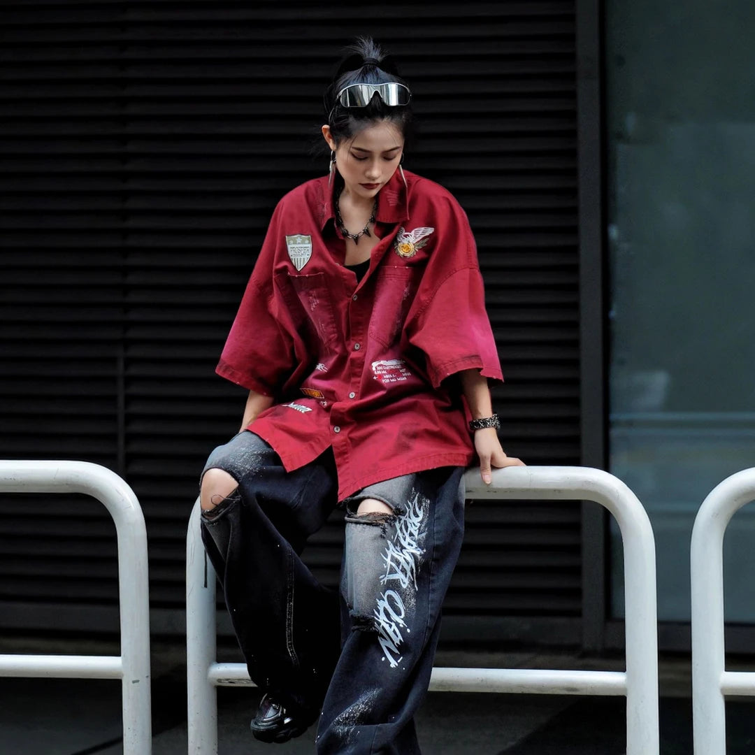 Sanhoostudio short sleeve shirt featuring military-inspired graphics, distressed dye finish, and relaxed silhouette. Designed for streetwear styling with breathable fabric and versatile daily wear.