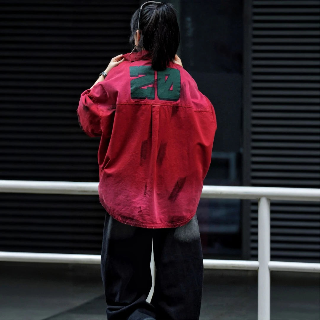Sanhoostudio short sleeve shirt featuring military-inspired graphics, distressed dye finish, and relaxed silhouette. Designed for streetwear styling with breathable fabric and versatile daily wear.