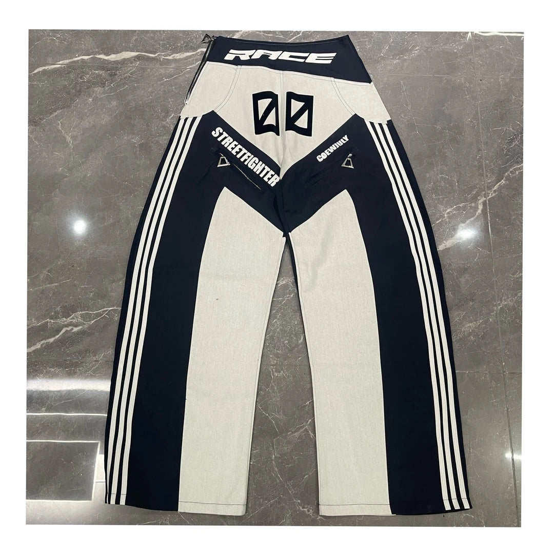 Sanhoostudio racing-inspired jacket featuring heavy patchwork construction and bold motorsport streetwear aesthetics.