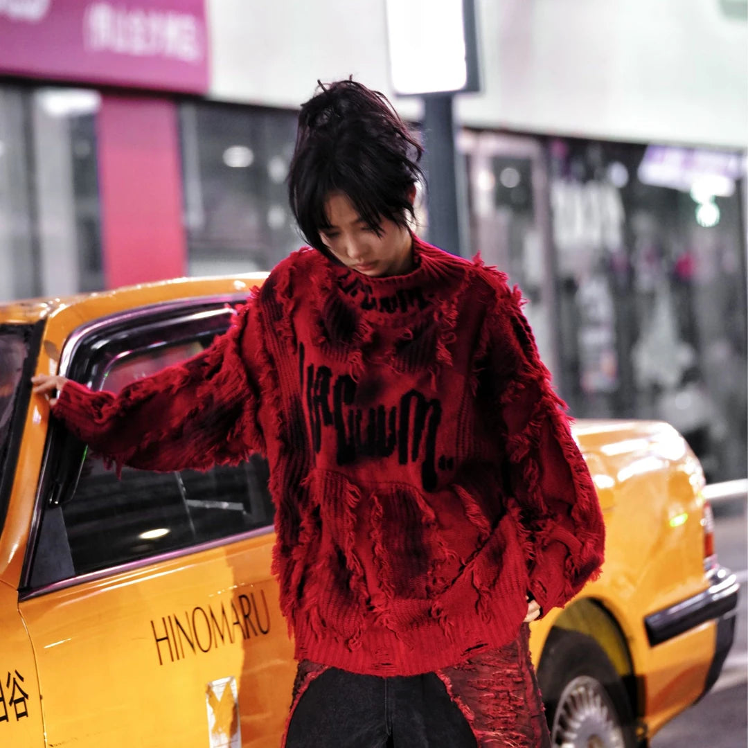 Street rebellion meets knit precision — this high-density graffiti sweater with distressed neck and paint-splash detail reflects SanhooStudio’s high-street chaos and raw design soul.